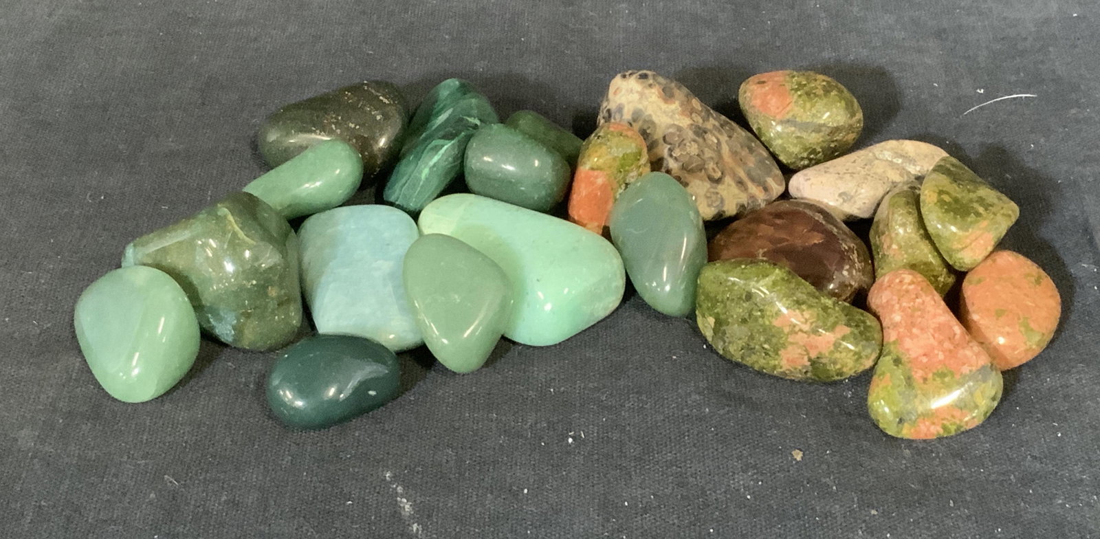 Group Lot Tumbled Green and Pink Stones: Group lot tumbled green and pink stones, lot consists of unakite aventurine one malachite and a lighter green/blue stone that is possibly Amazonite as well as some unidentified stones, lot consists of