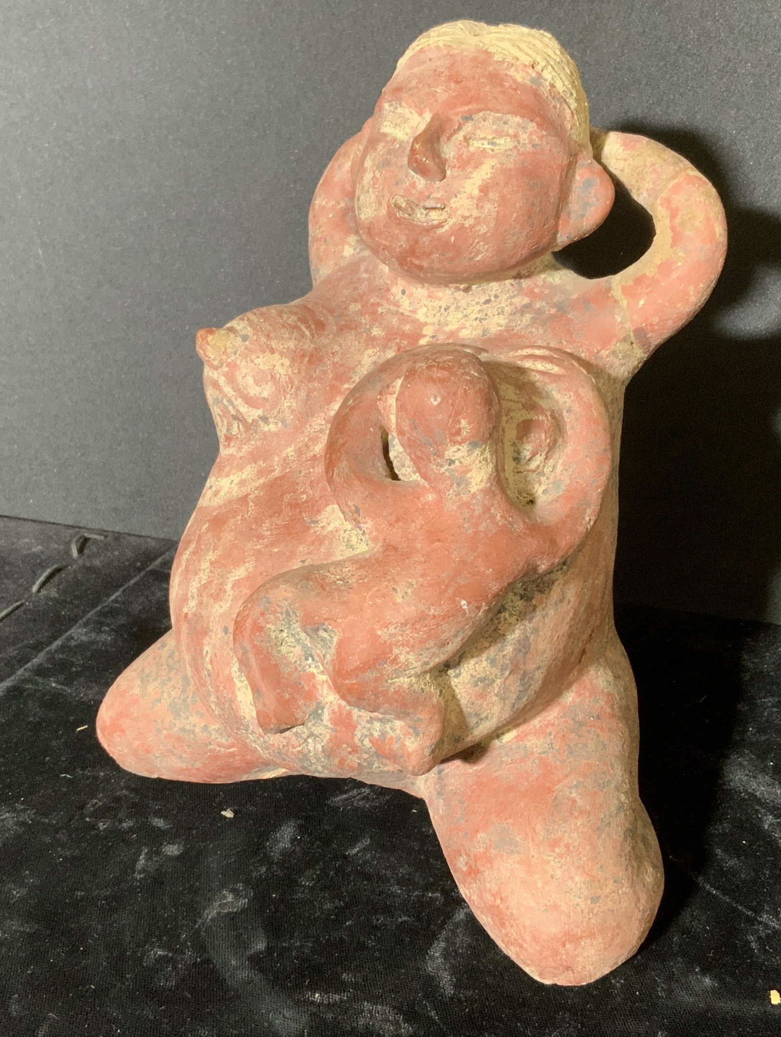 Folk Art Handmade Fertility Idol: Folk art handmade fertility idol. Depicts a woman breast feeding a child. Wear is consistent with age and use, loss present, evidence of repair. Measures approx 6.5 inches h and 6.25. Home decor, deco