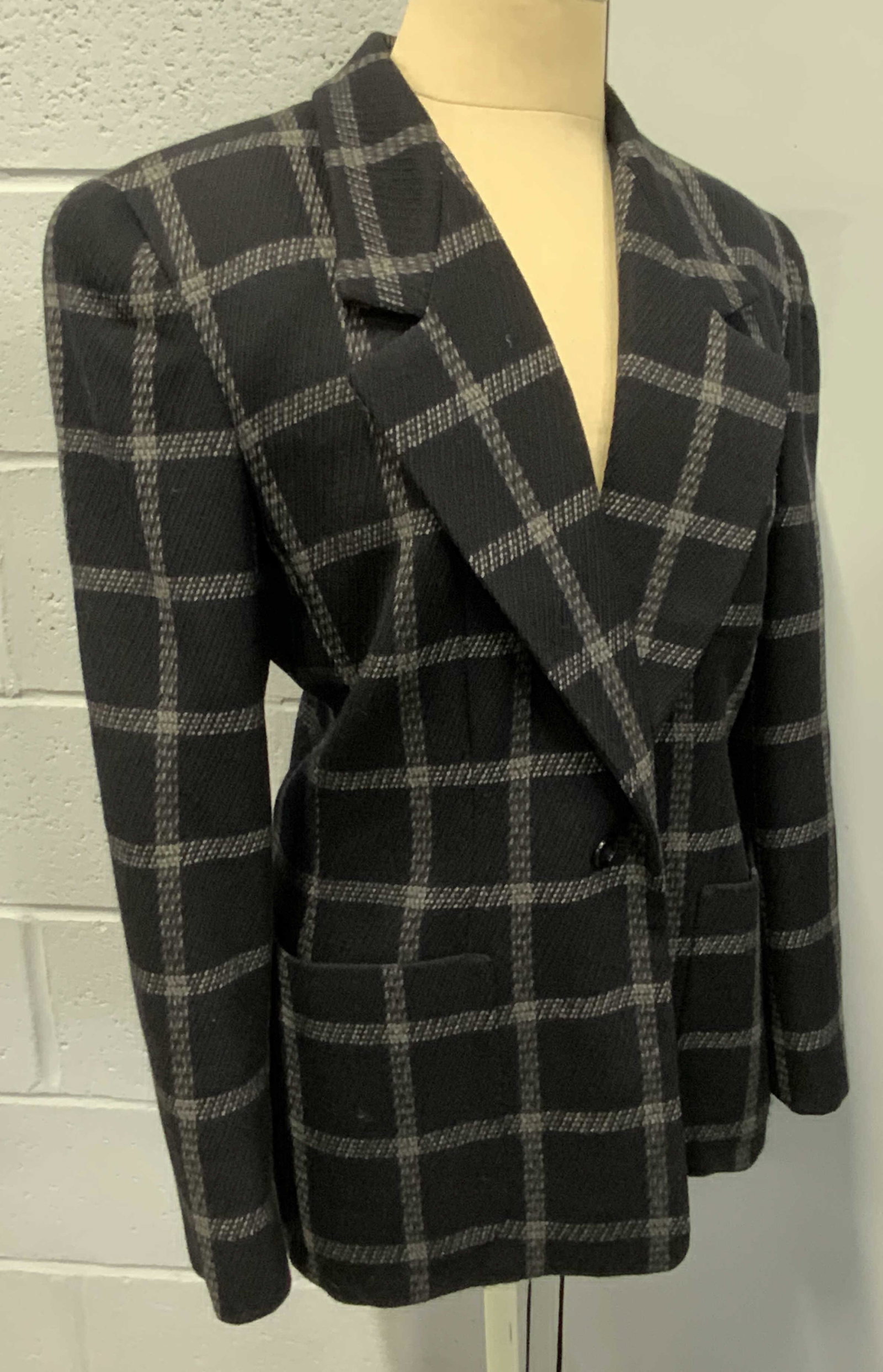 ANNE KLEIN Vintage Navy Plaid Blazer: A deep navy hued and white plaid blazer. Two exterior pockets. One button to obverse. Lined interior. Padded shoulder. Tags read ANNE KLEIN. Size tag reads 6. Material says Made of Imported fabric, Ma