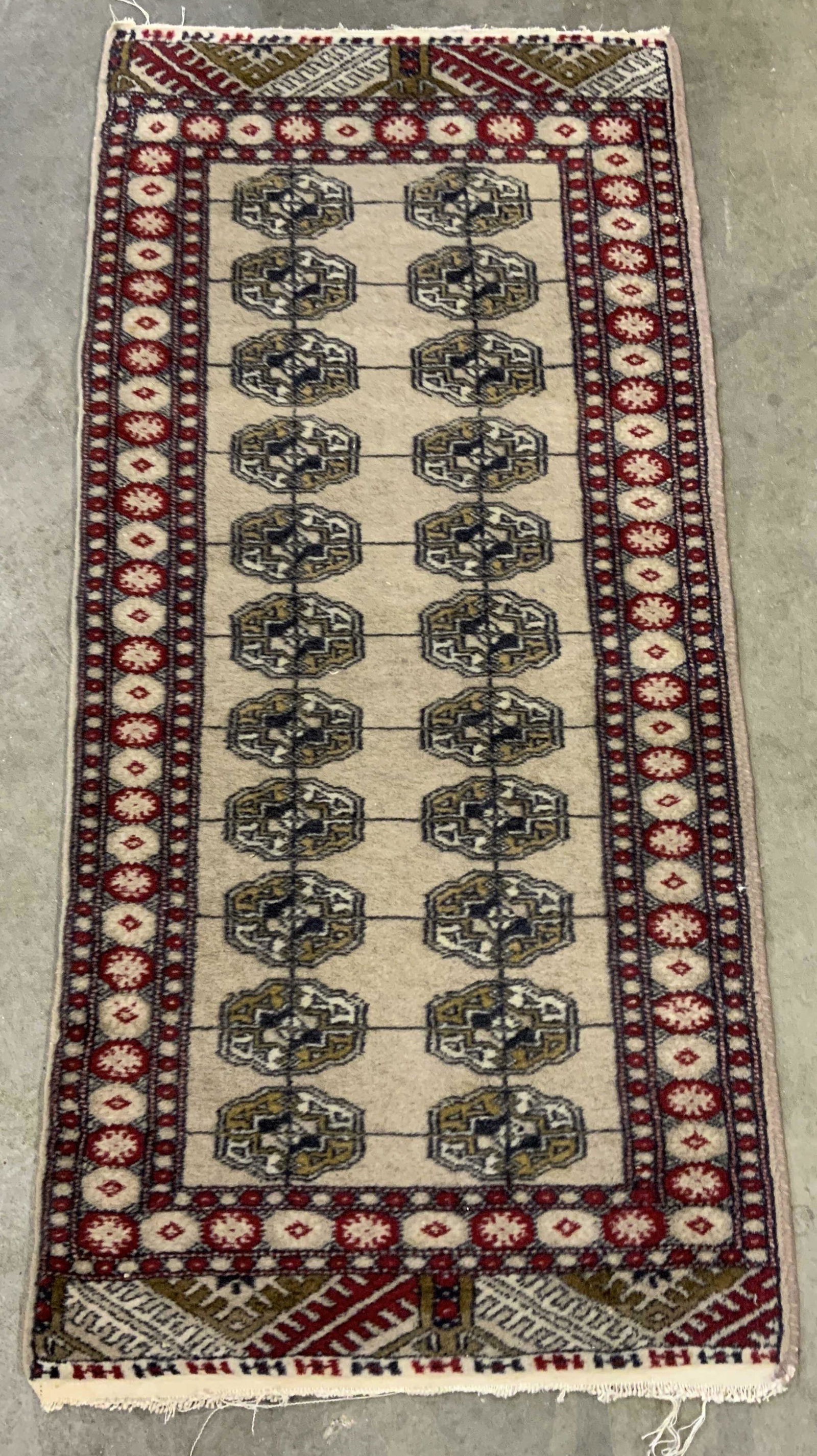Vintage Persian Area Rug: Vintage, possibly antique, Persian area rug. Decorated with multi toned geometric patterns. Fringes are worn. Wear is consistent with age and use, surface wear, needs cleaning Measures approx 49 inche