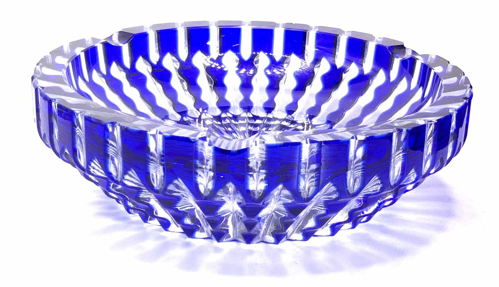Vintage Cut Cobalt Bohemian Glass Trinket Bowl: A vintage cut clear & cobalt blue bohemian glass trinket dish / ashtray. Thick walled. Measures approx 1.75H x 6W in. Some chipping present. Property of Manhattan, New York Estate. Vintage Cut Cobalt 