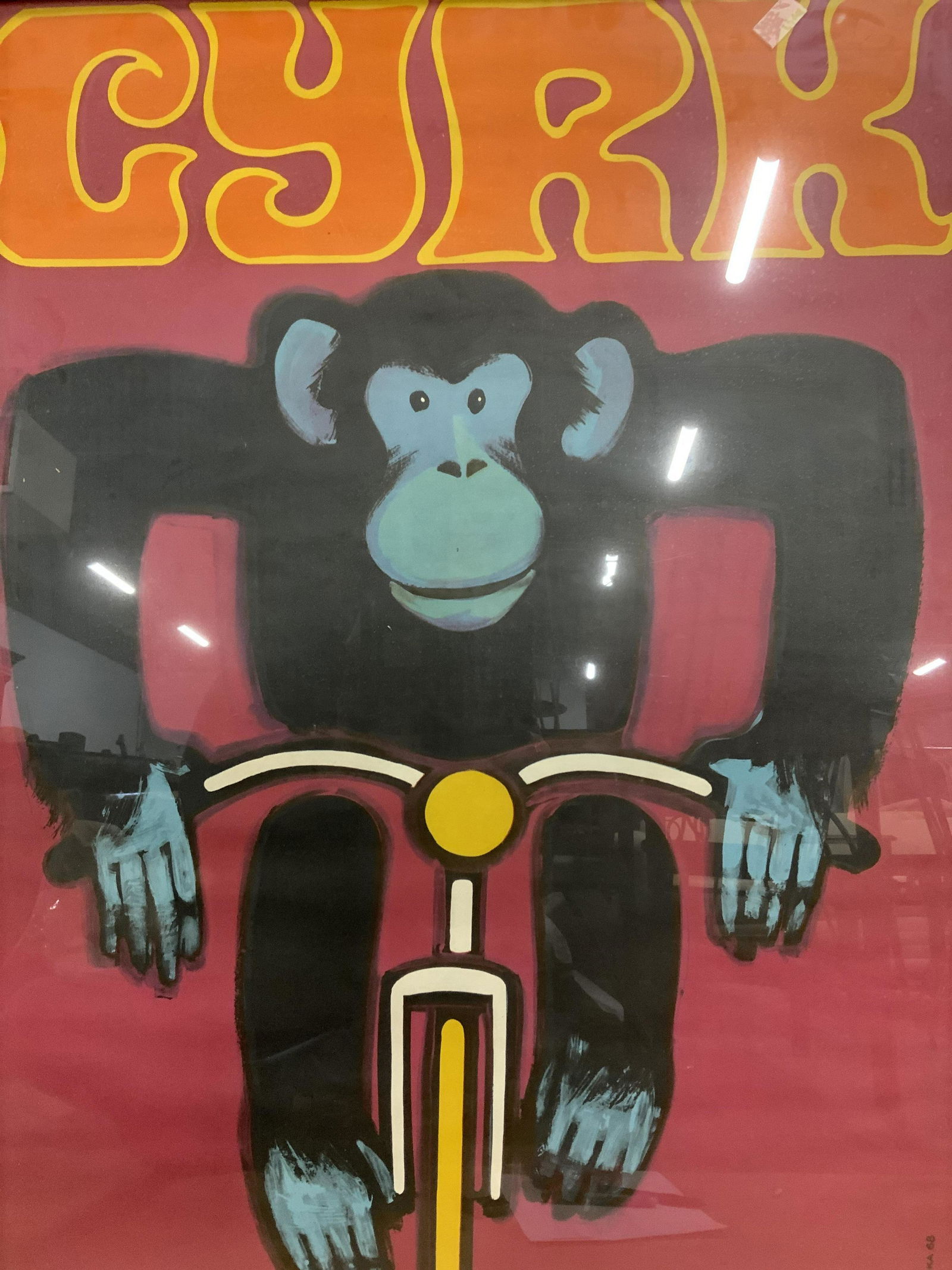 Framed WIKTOR GORKA Cyrk Monkey Lithograph 1968: WIKTOR GORKA Cyrk Monkey Lithograph 1968, artist signature stamped to lower right reads W. GORKA 68, shows a monkey riding a bicycle with the text above his head which reads CYRK, in bright yellow and