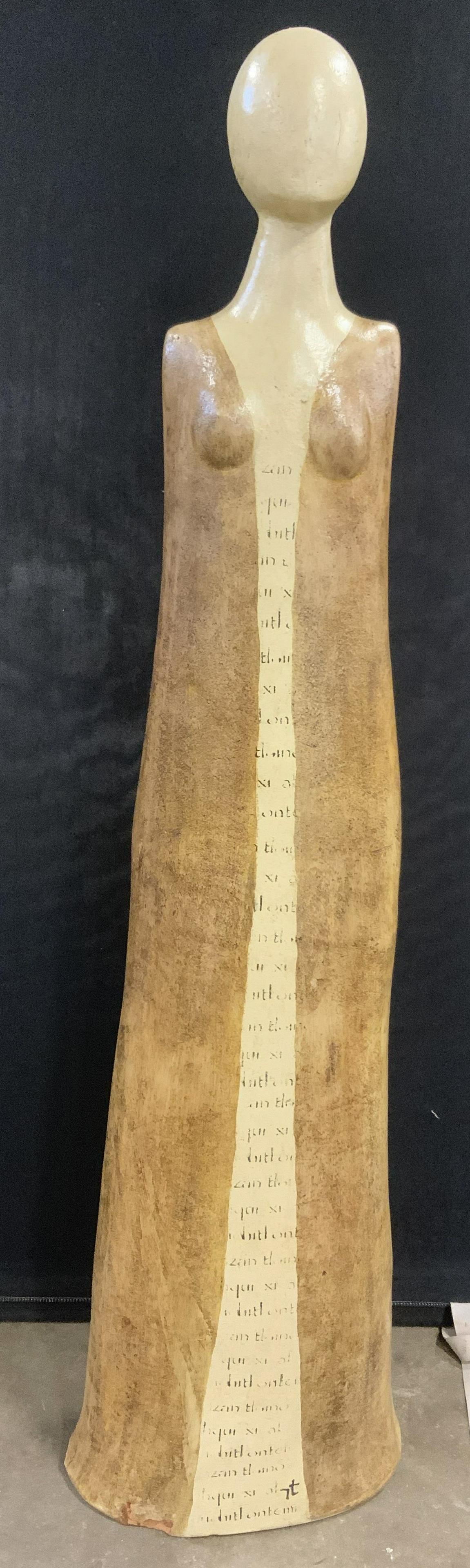 Hand Painted Earthenware Floor Size Sculpture 49in: Hand painted earthenware sculpture. Feminine form, base is off white, bone toned, caramel toned striations extend from the figure shoulder to the floor. Text lays between the striations. No apparent m