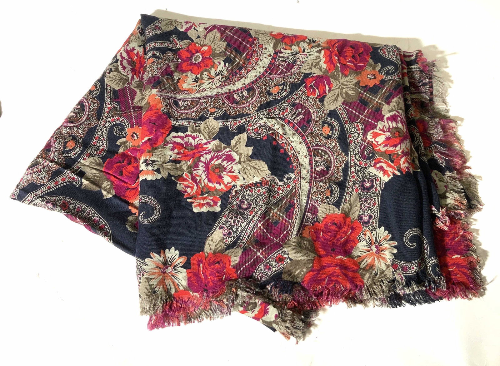Floral & Paisley Rayon Scarf: Floral & Paisley Rayon Scarf, material possibly rayon or polyester, soft hand, scarf has black base tone with accents of red, magenta, and gold threading. Property of Trump Tower Manhattan and Bedford
