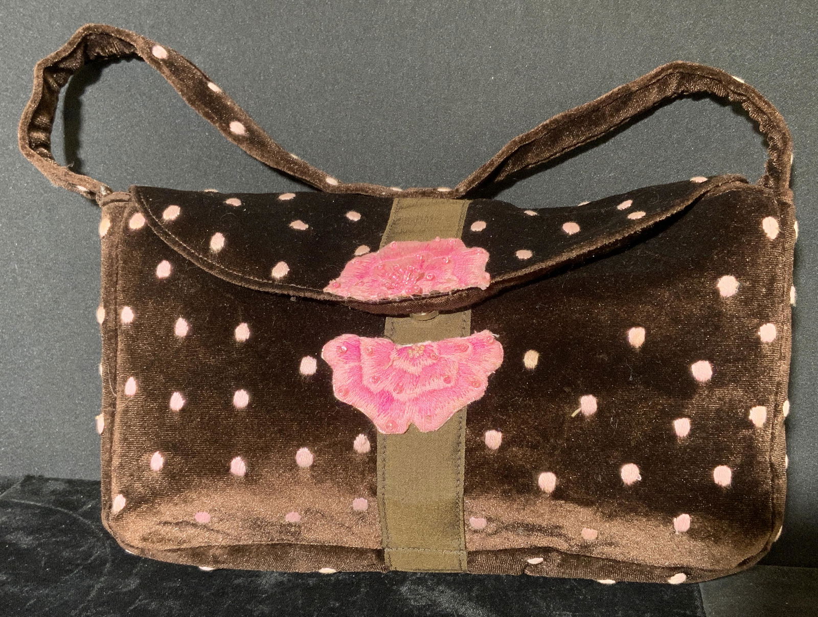 SEA GLASS Embroidered Purse: Embroidered purse. Seals with a button, embroidery depicts polka dots and a flower. Label reads as New York, Hong Kong, Seaglass Collection. Measures approx 6.25 inches h and 10.25 inches w, 7.5 inch