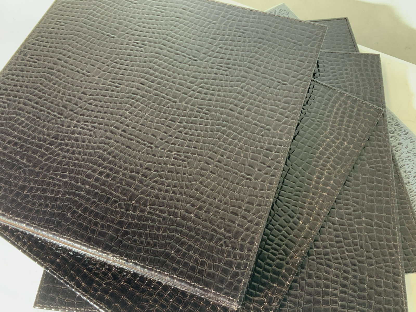 ZGallerie Set12 Everglades Croc Style Placemats: New never used, many with original store tag. Tag reads Z Gallerie Everglades PMAT Brown Brown 15x15. Some in original plastic wrap. All with brown suede undersides and croc leather tops. Nicely stitc
