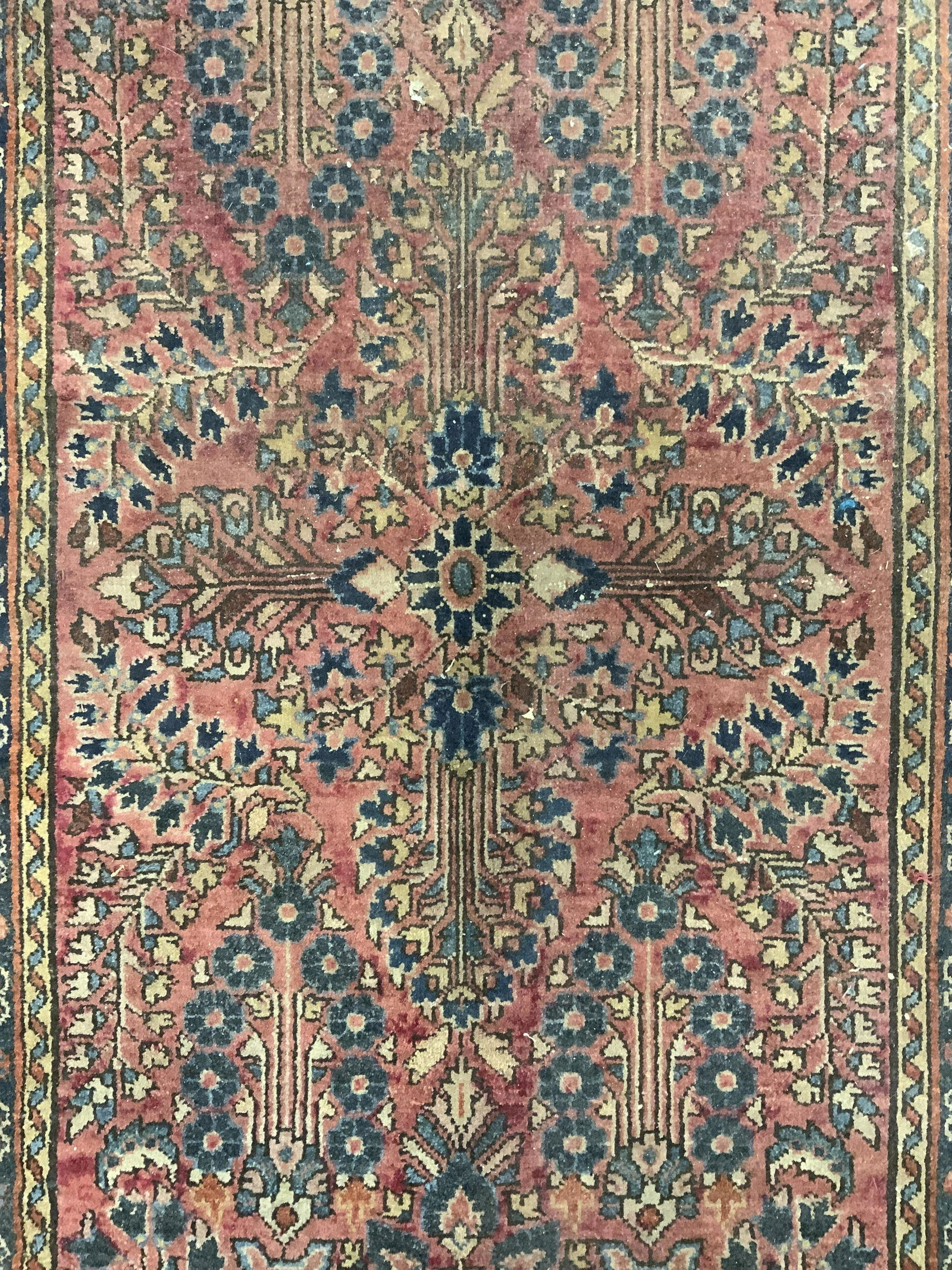 Antique Handmade Persian Wool Rug: Rug is handmade and wool. Piece is vintage possibly antique. Rug appears to be Persian porcelain oriental. Rug has intricate multi toned floral, vine & leaf detail. Piece measures approx 50 inches lon