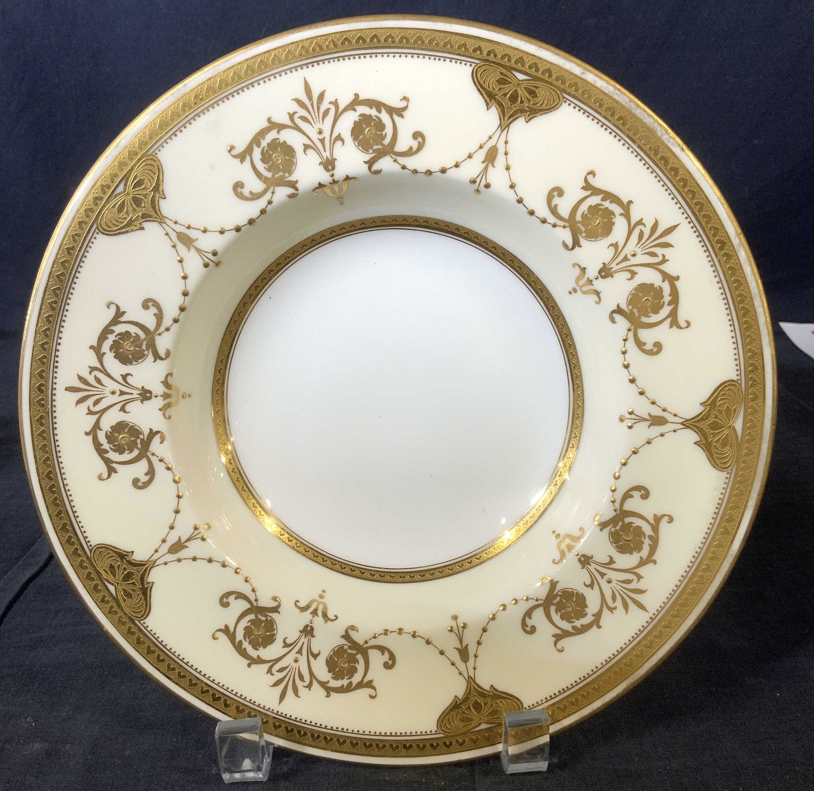 Set 4 MINTONS Davis Collamore & Co Bowls, England: Luxury fine bone china bowls/ soup bowl, made in England, wide rim with Victorian Pattern , raised patterned Gilt on cream toned porcelain, with center of bowl white porcelain. Measures 8.75 in. Diame