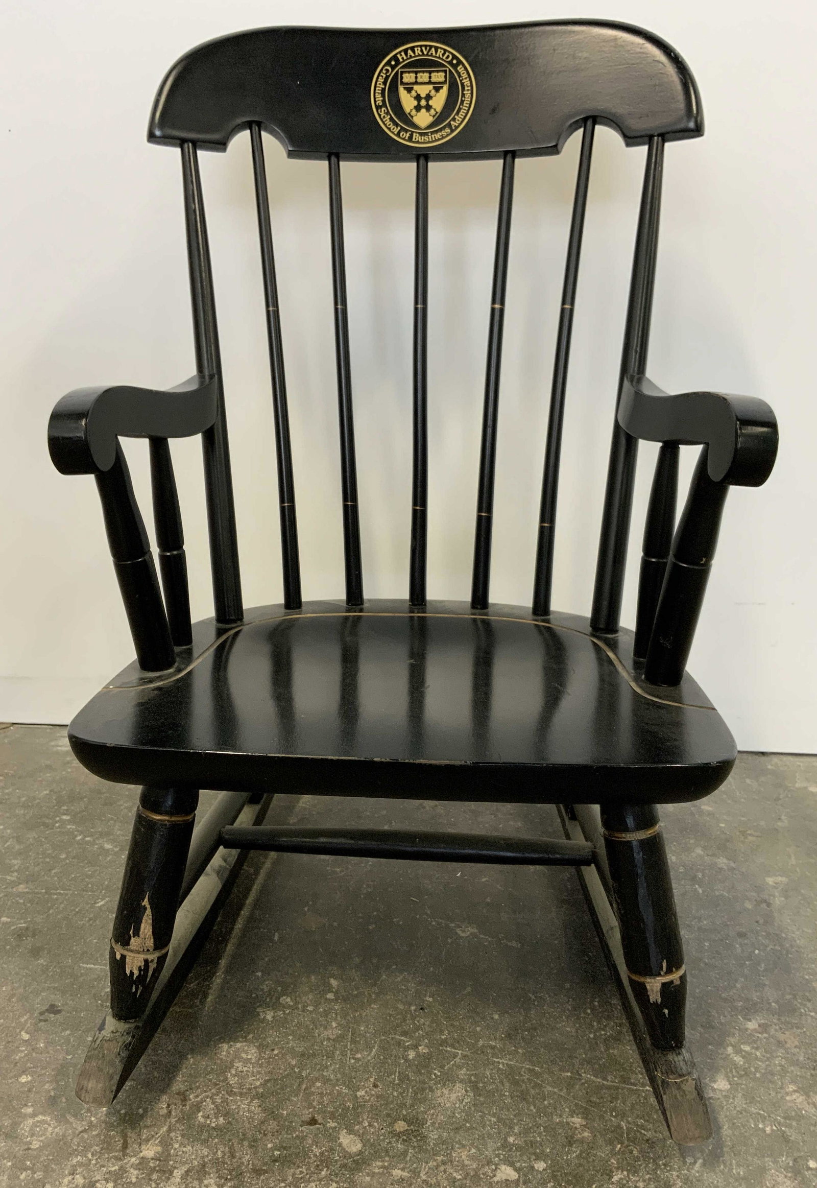 Wooden Childrens Rocking Chair: Wooden childrens rocking chair. Top of back reads as Harvard Graduate School of Business Administration. Wear to paint. Measures approx 27 inches h 16 inches w, 21 inches deep. Home decor, decorative 