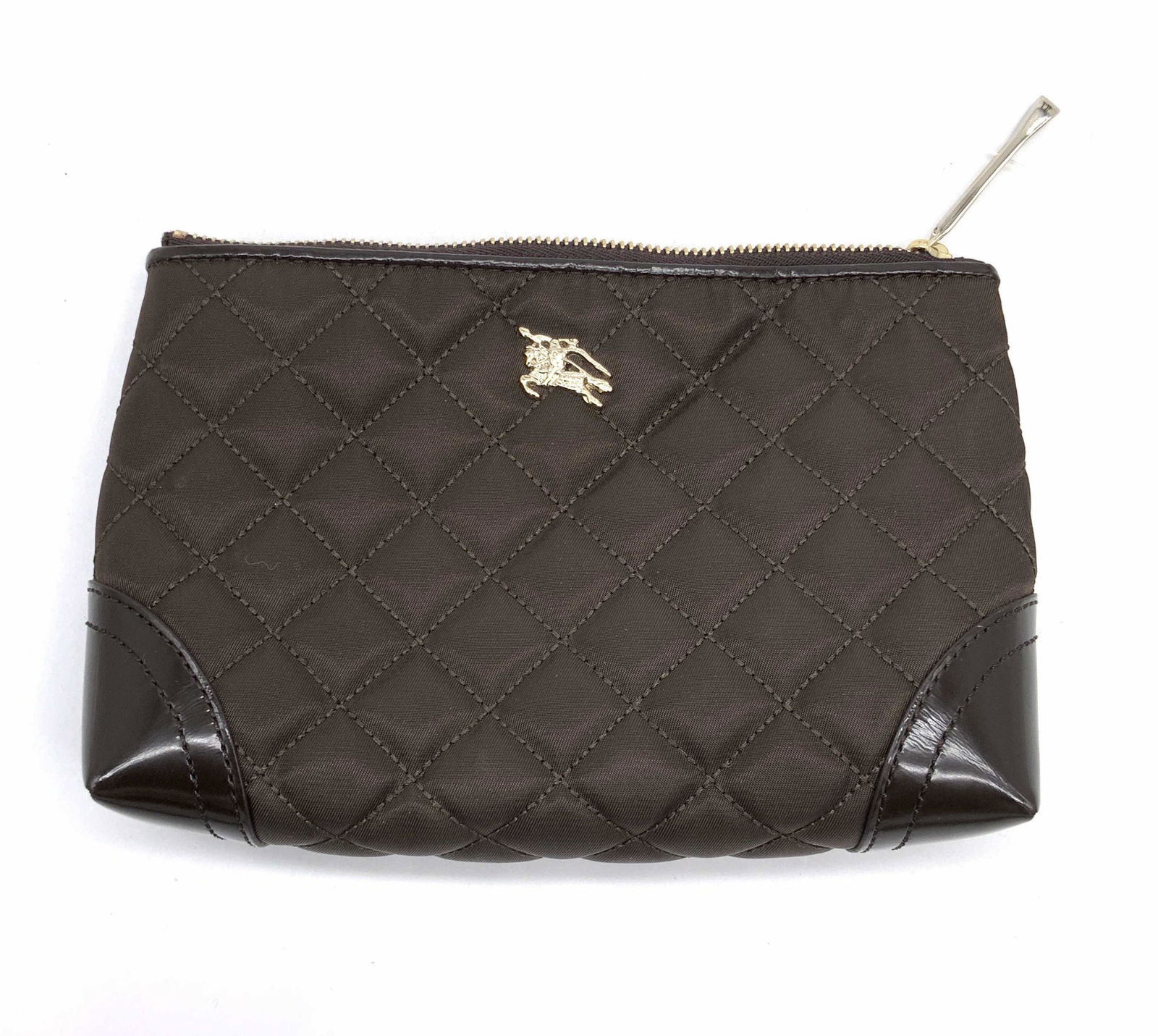 BURBERRY Brown Quilted Clutch, NWT & Card: A brown hued fabric and leather style Burberry clutch. Obverse features raised Burberry trademark. Interior features Burberry trademark and reads Burberry. Interior possesses original price tag from B