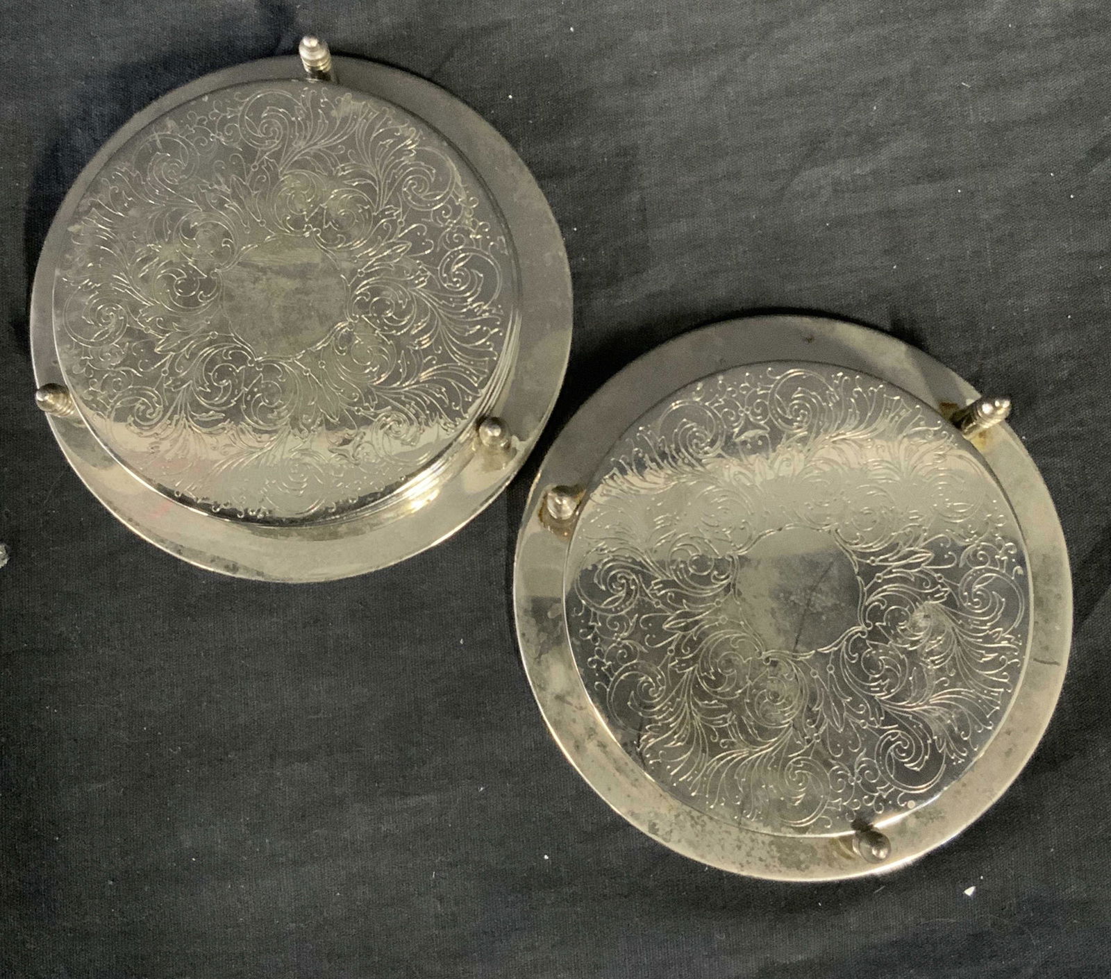 Art Deco Silver Plated Coasters: Art Deco Silver Plated Coasters With relief work, set of 11, swirls and floral accents, each measures 3 1/2 inches wide. Property of Manhattan, NY estate. Coasters, decorative coasters, Art Deco, Art