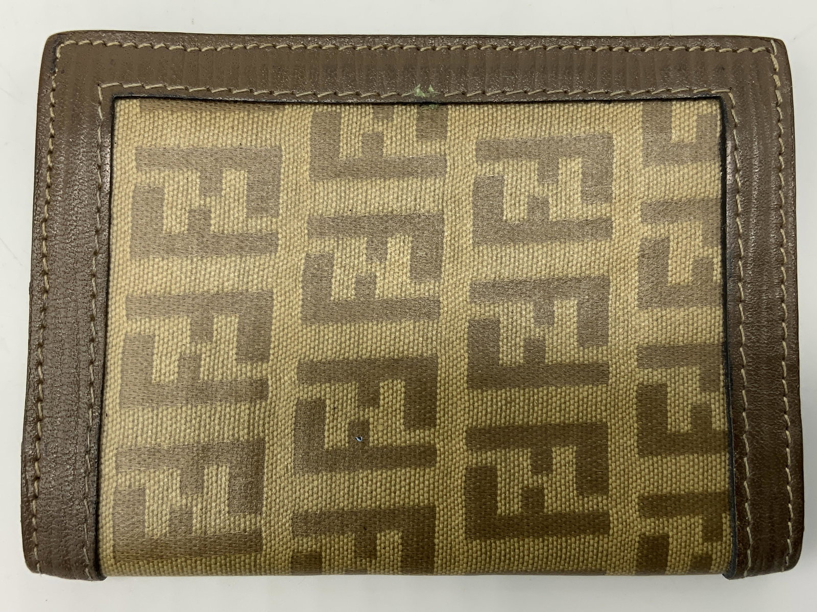 FENDI Card Holder, Italy: FENDI Card Holder, Italy, Brown & beige FENDI insignia reticulated design, leatherette trim and interior, two interior pockets to hold CC, comes with drawstring protective covering, measures approx 3 