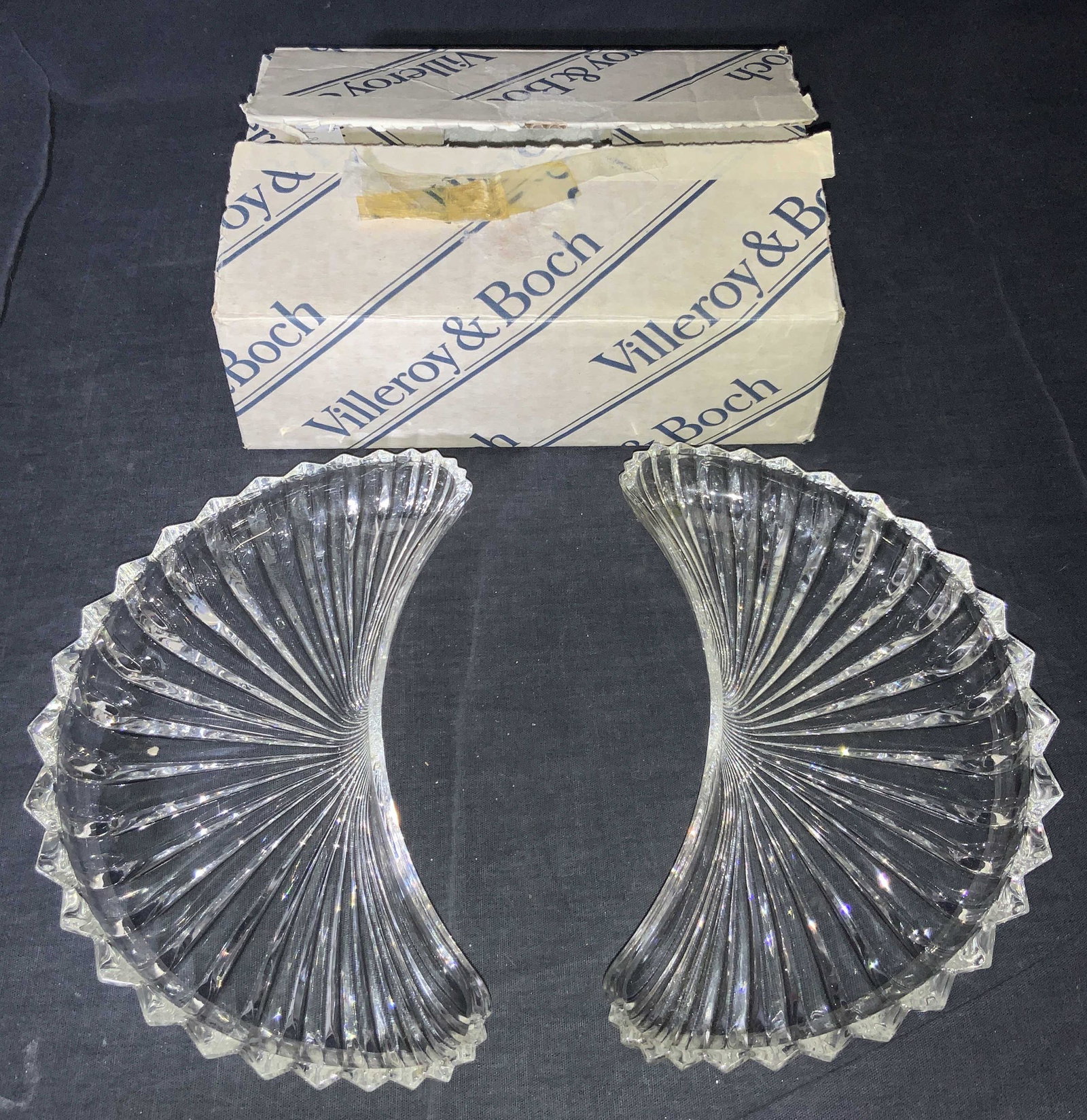 Cut Glass Saw Tooth Crescent Dishes: A set of 2 cut glass bowls in a crescent shape with saw tooth rims, that come in a VILLEROY & Boch Box. Dishes are approximately 8.5 x 4.25 x 1 inches. Box is approximately 8.75 x 6.5 x 3 inches. Dish