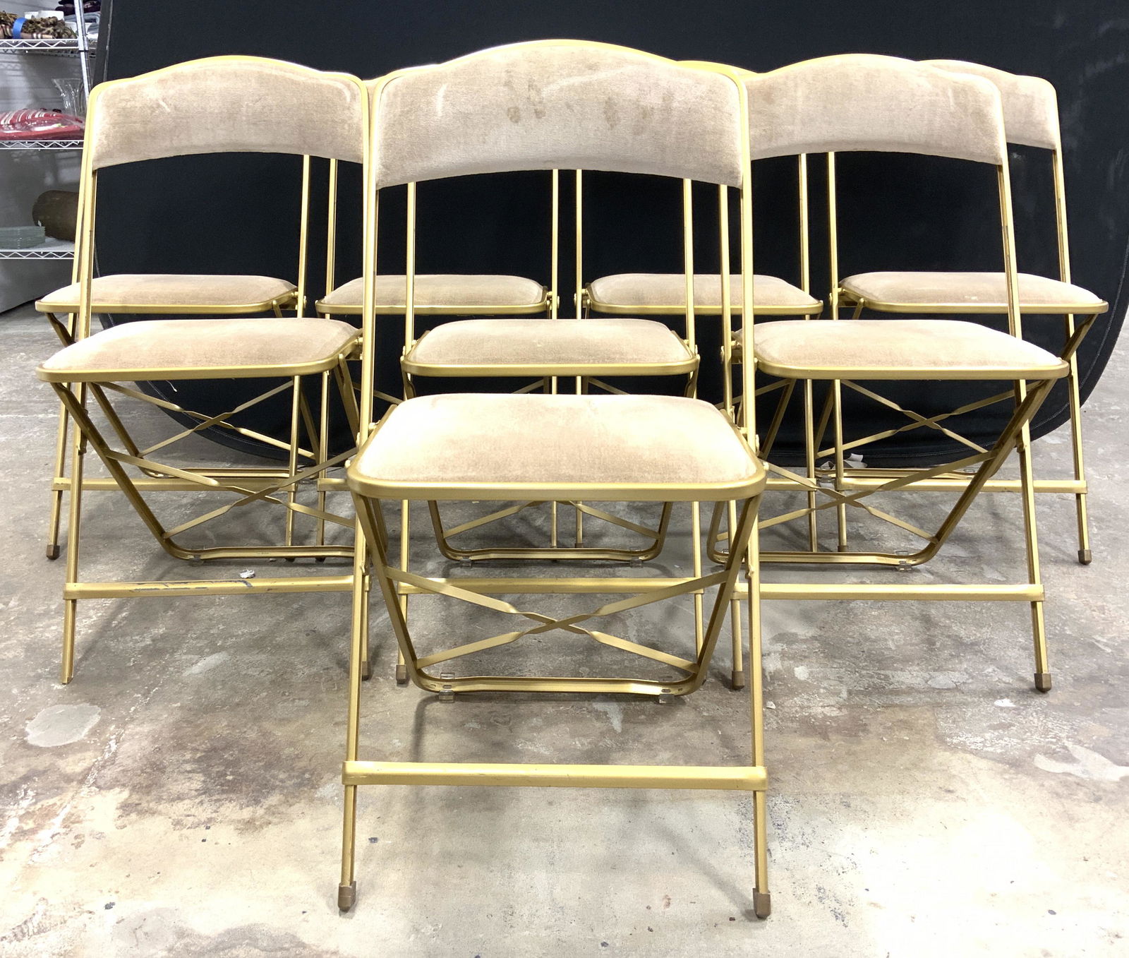 Set 8 FRITZ Style Upholstered Folding Chairs: Lot includes 8 folding chairs. Each are FRITZ style. Chairs each have gold toned metal frames which appear to be gilded. Each chair has upholstered backrest & seat cushion. Upholstery is light beige t