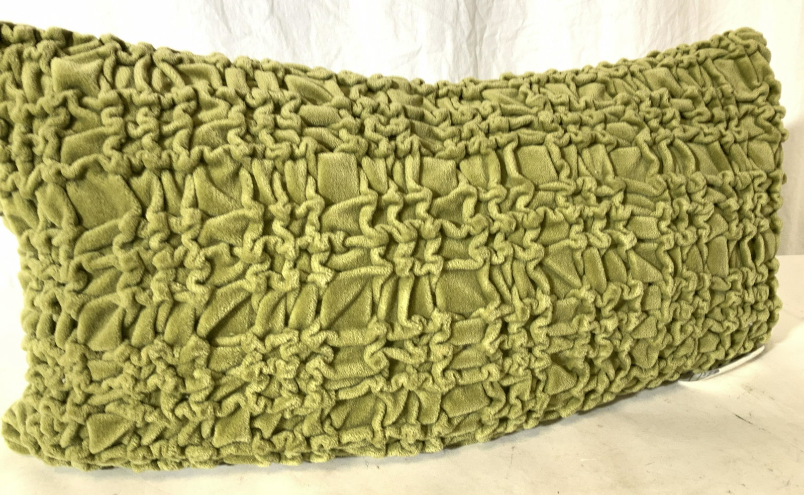 Olive Green Ruched Velour Feather Pillow: Feather and Down pillow form ( with tag manufacturing attached to pillow ) with pillow cover. Ruched frontside pattern, olive green soft hand velour, with smooth zipper. Pillow measures 22 x 10 in. up