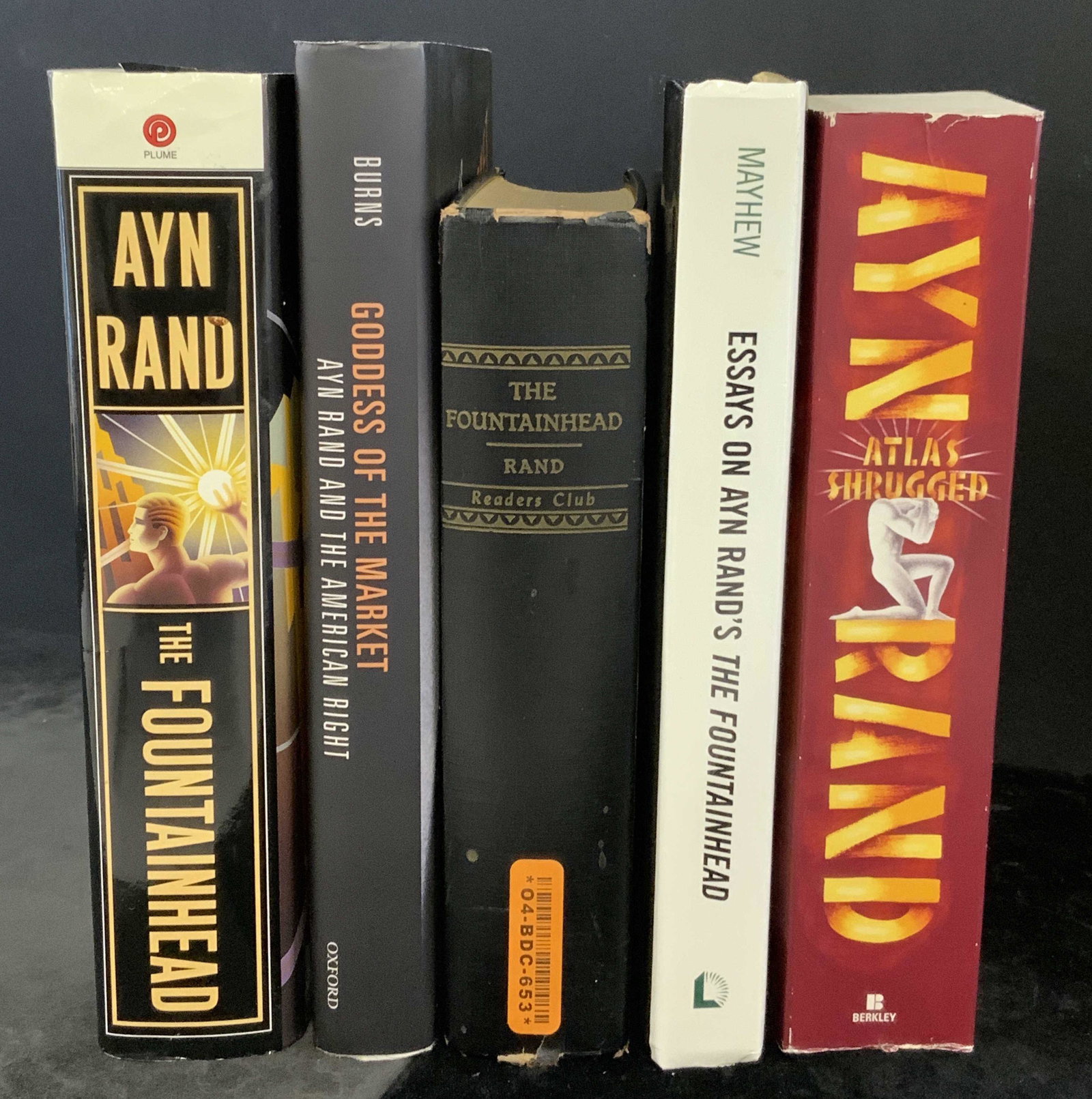 Lot 5 Hardcover/Paperback Books AYN RAND & Others: Includes Atlas Shrugged 2015, two copies of The Fountainhead, copyrighted 2002 and 1943, by AYN Rand. 1943 publication information reads as This is a special edition published exclusively for the memb