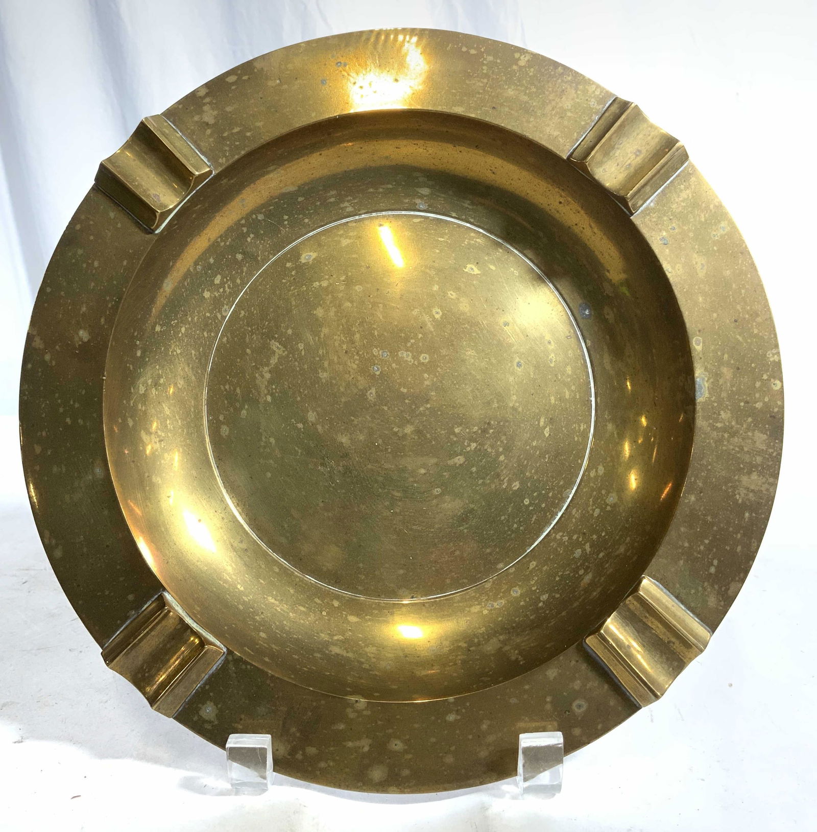 Vintage Gold Toned Brass Bowl: Bowl is vintage and brass. Piece is gold toned with circular shape. Piece has 4 raised areas. Piece measures approx 10 inches wide. Bowl, brass bowl, vintage bowl, vintage brass bowl, tabletop accesso