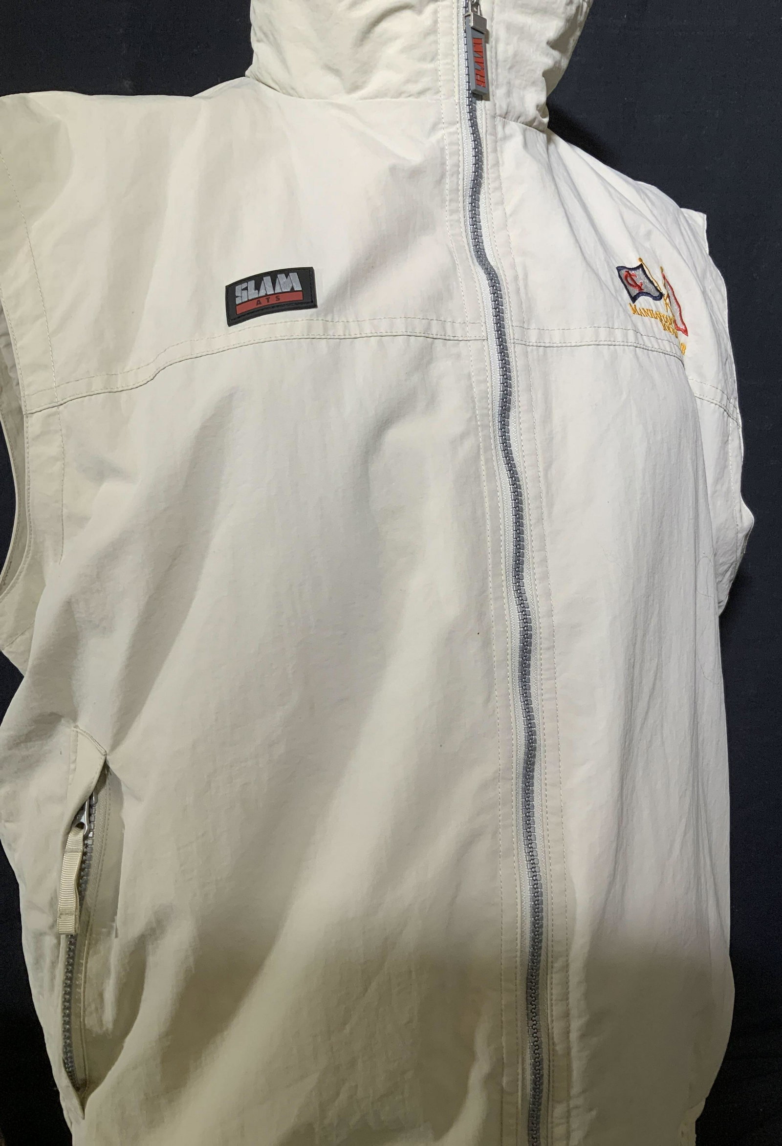 SLAM Manhattan Yacht Club Vest, Italy: Nylon vest with breathable net interior, sportswear for men or women. Tan color, labeled Slam Italian Design. AppliquÃ© and embroidery patch to front reads Manhattan Yacht Club IOD Fleet. Size Large