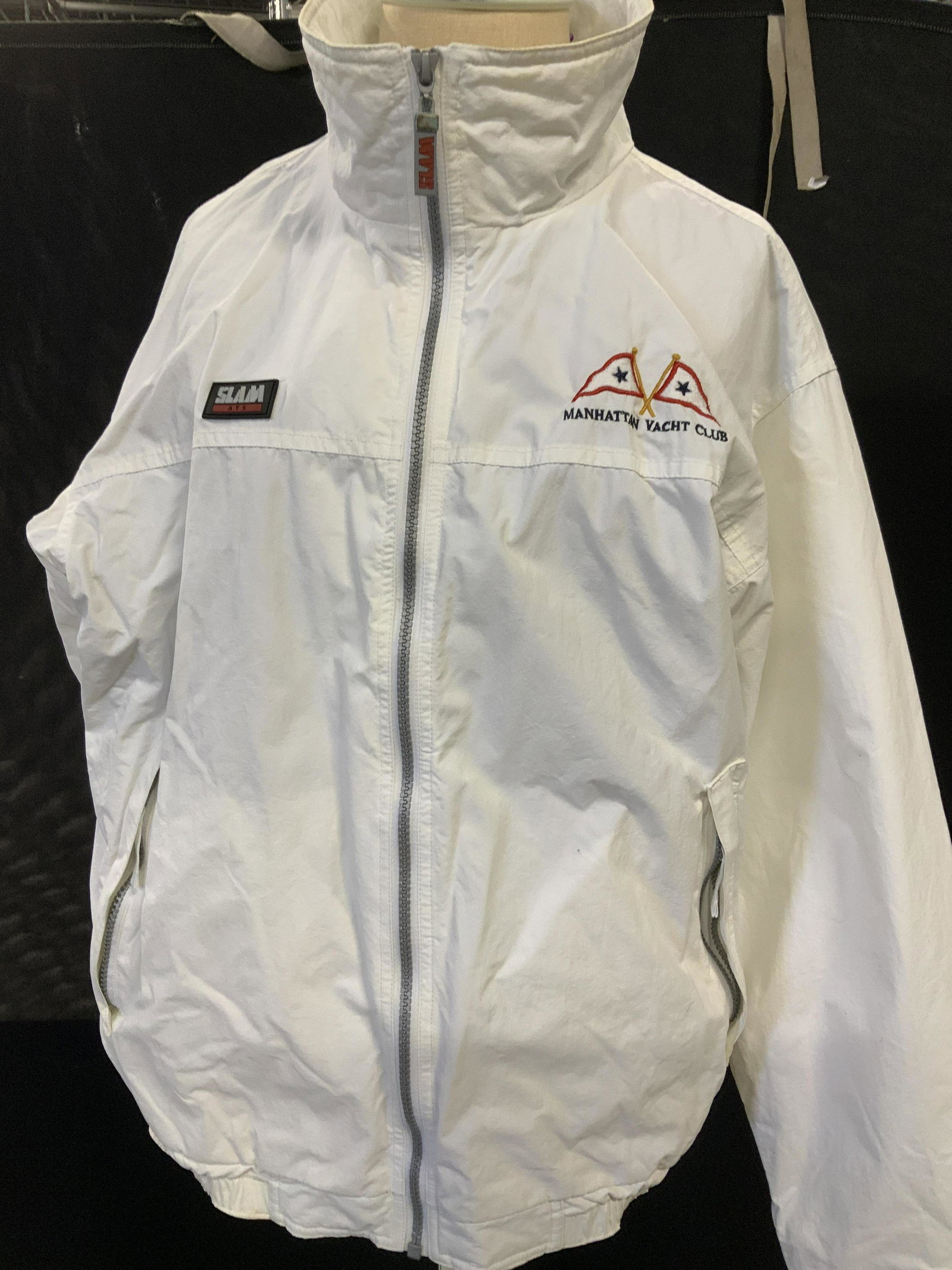 SLAM Manhattan Yacht Club Jacket, Italy: White Nylon jacket with breathable net interior, sportswear for men or women. labeled Slam Advanced Technology Sportswear, Italian Design. Size Medium. Applique and embroidery patch to front reads Man