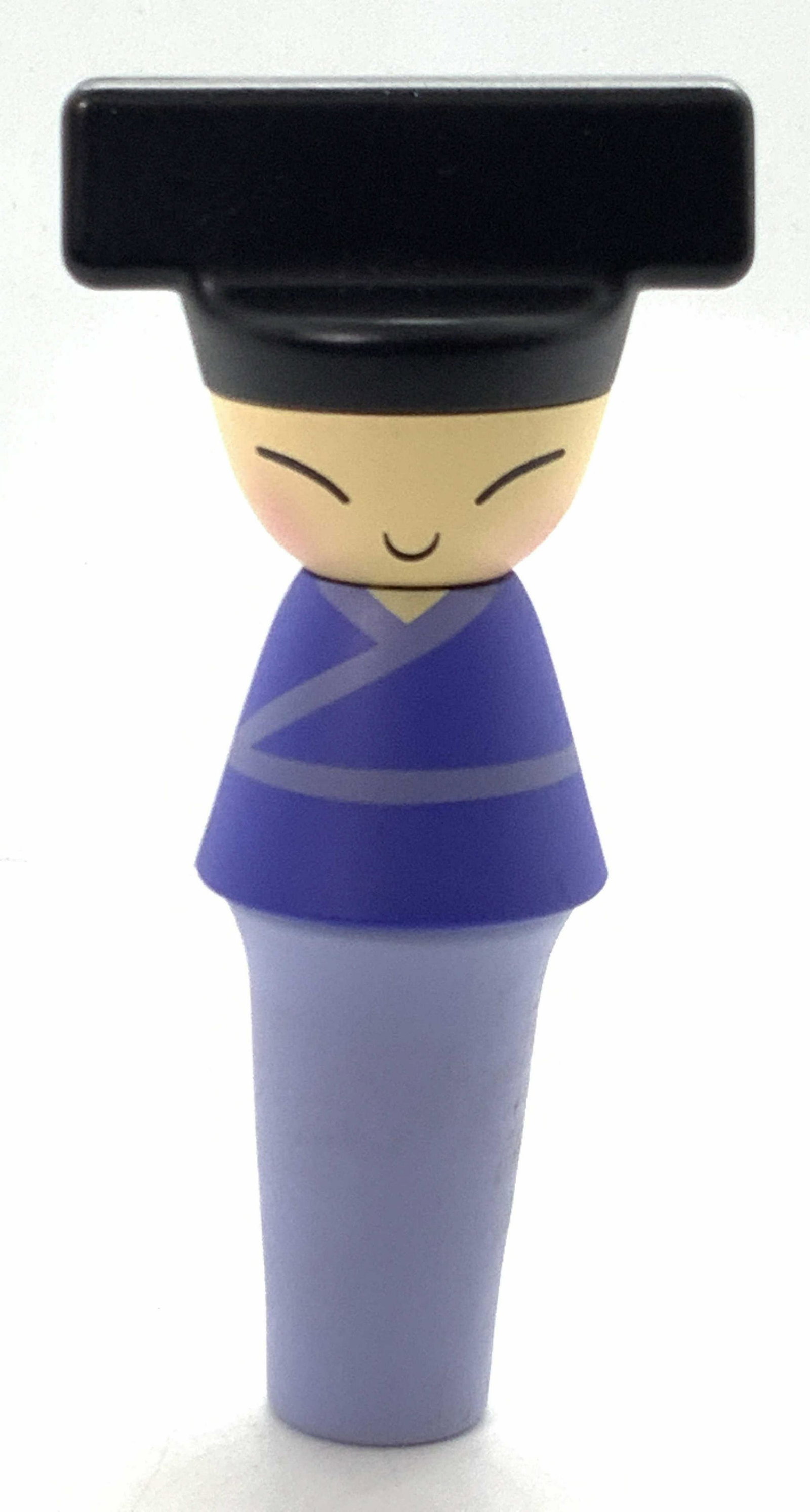 ALESSI Asian Style Wine Bottle Stopper: A wine bottle stopper hand decorated to resemble an Asian character with traditional purple toned robes. Marked A di Alessi Stefano Giovannoni with Rumiko Takeda, hand decorated. Approximately 3.5 inc