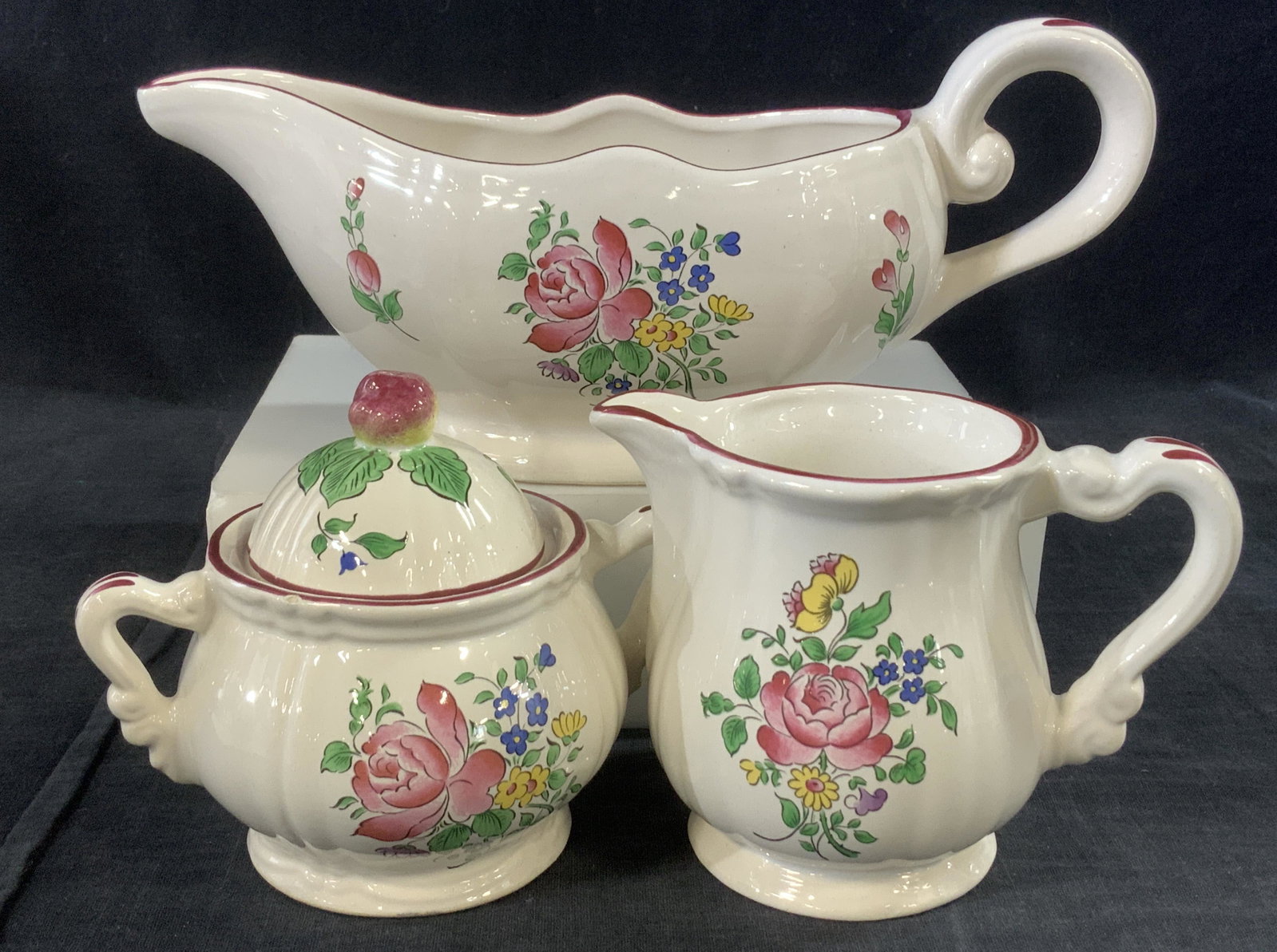 LUNEVILLE 3 Piece Ceramic Tableware, France: Signed Luneville Old Strasbourg Ceramic Gravy boat, sugar bowl and creamer. Made in France. Hand painted roses and flowers on white ceramic. Gravy boat measures 10 in. Long, app 4 in. Ht. Small chip t
