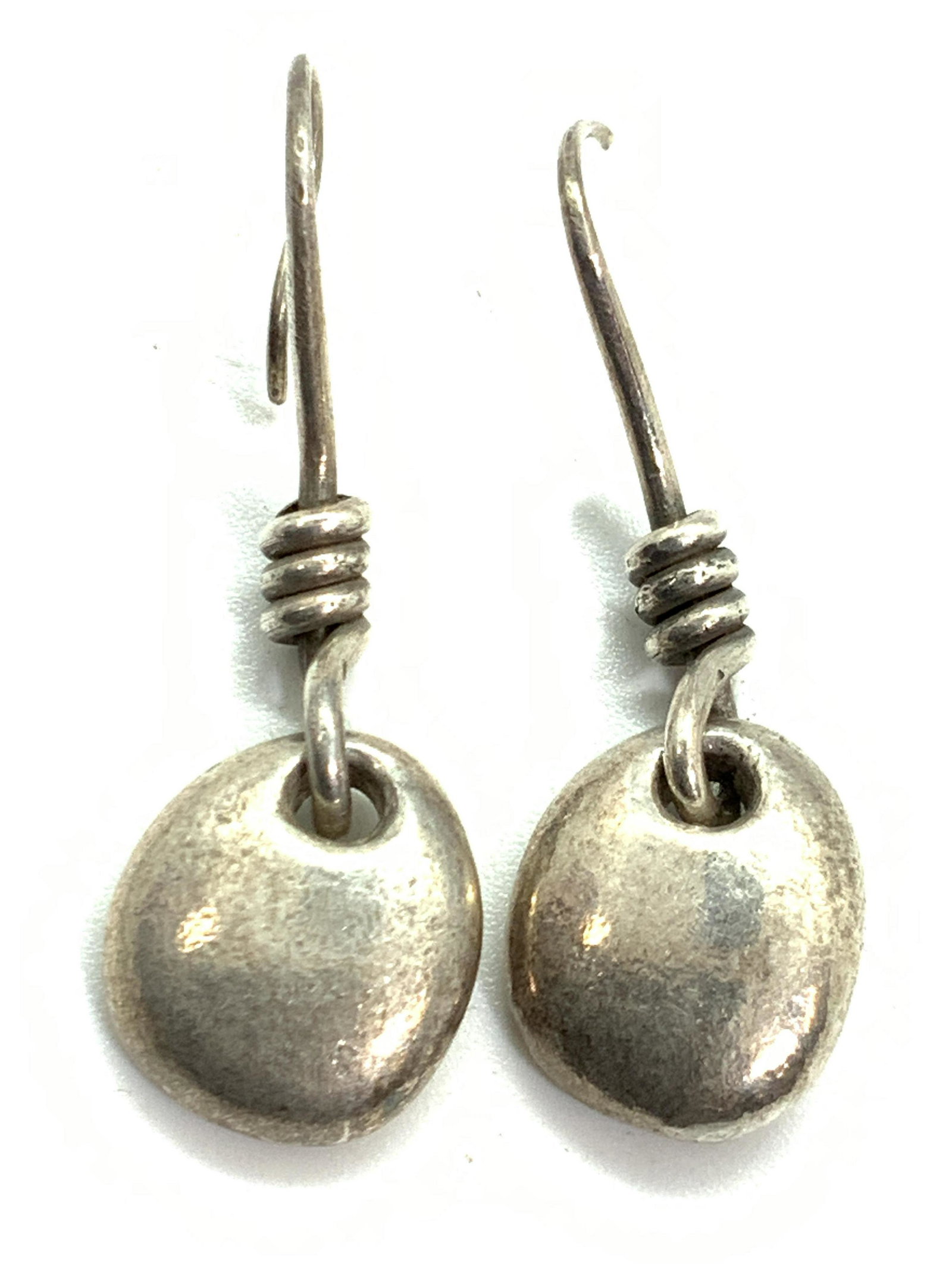 Vintage Sterling Silver Hand Crafted Drop Earrings: Pair of vintage sterling silver drop earrings. Hand crafted. Marked with Passats, possibly crown, panther, and s. Total weight 0.45 ozt. Approximately 1.75 inches long. Fish hook to one earring is bro