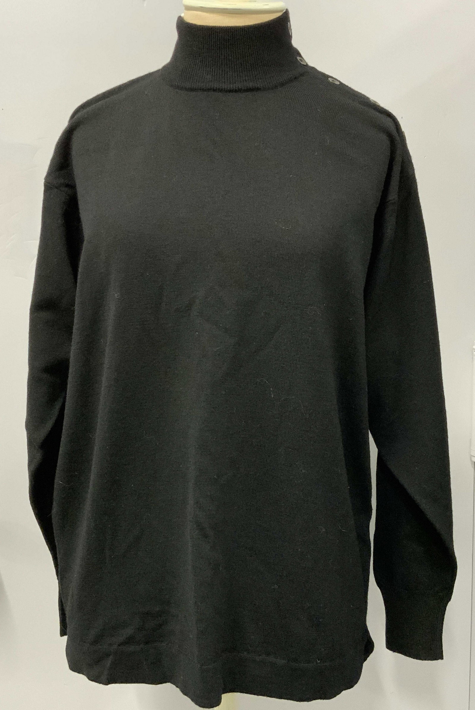 Le Tricot Perugia Mock Turtleneck Sweater, Italy: Label reads Le Tricot Perugia Made in Italy. Mock Turtleneck Button-Shoulder Sweater, Italy, black with slate grey buttons, measures approx 27 in. long x 18 in. wide. Property of Manhattan, New York E