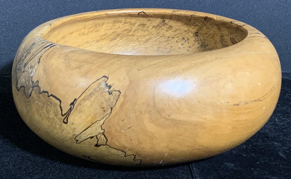 Vintage PATRICK Signed Artisan Wooden Bowl: A vintage artisanal wooden bowl. Handcrafted, organic form. Some raw rough edges. Underside signed, possibly reads PATRICK. Bowl is thick walled. Measures approx 4H x 8W in. Measured at widest point. 