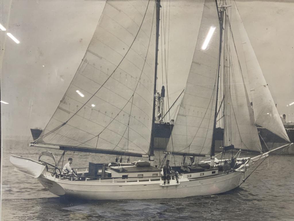 Framed Vintage Photograph of Men On a Sailboat: Framed Vintage Photograph of Men On a Sailboat, no apparent Hallmarks, shows men on a sailboat, measures 18 1/2 x 14 1/2 inches, blue toned metal frame, surface wear to frame, professionally framed, n