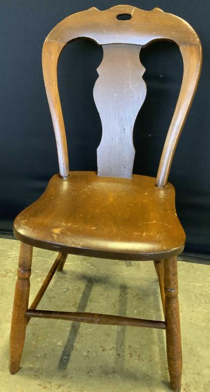 Vintage Carved Wooden Side Chair: Vintage, possibly antique, wooden side chair. Carved details. Rich brown hue. Four legs. Stretcher to each leg. Measures approx 33Height x 16Width x 15Depth, inches. Surface wear, some separation at j