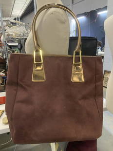 Estee Lauder Suede Style Tote Bag: Vintage Brown Fabric tote with bronze leatherette accents and handles. Suede feel fabric. Interior with moderate discoloration . Bag measures 12.25 x 13.25 in. Width opens to 8 in. Property of Manhatt