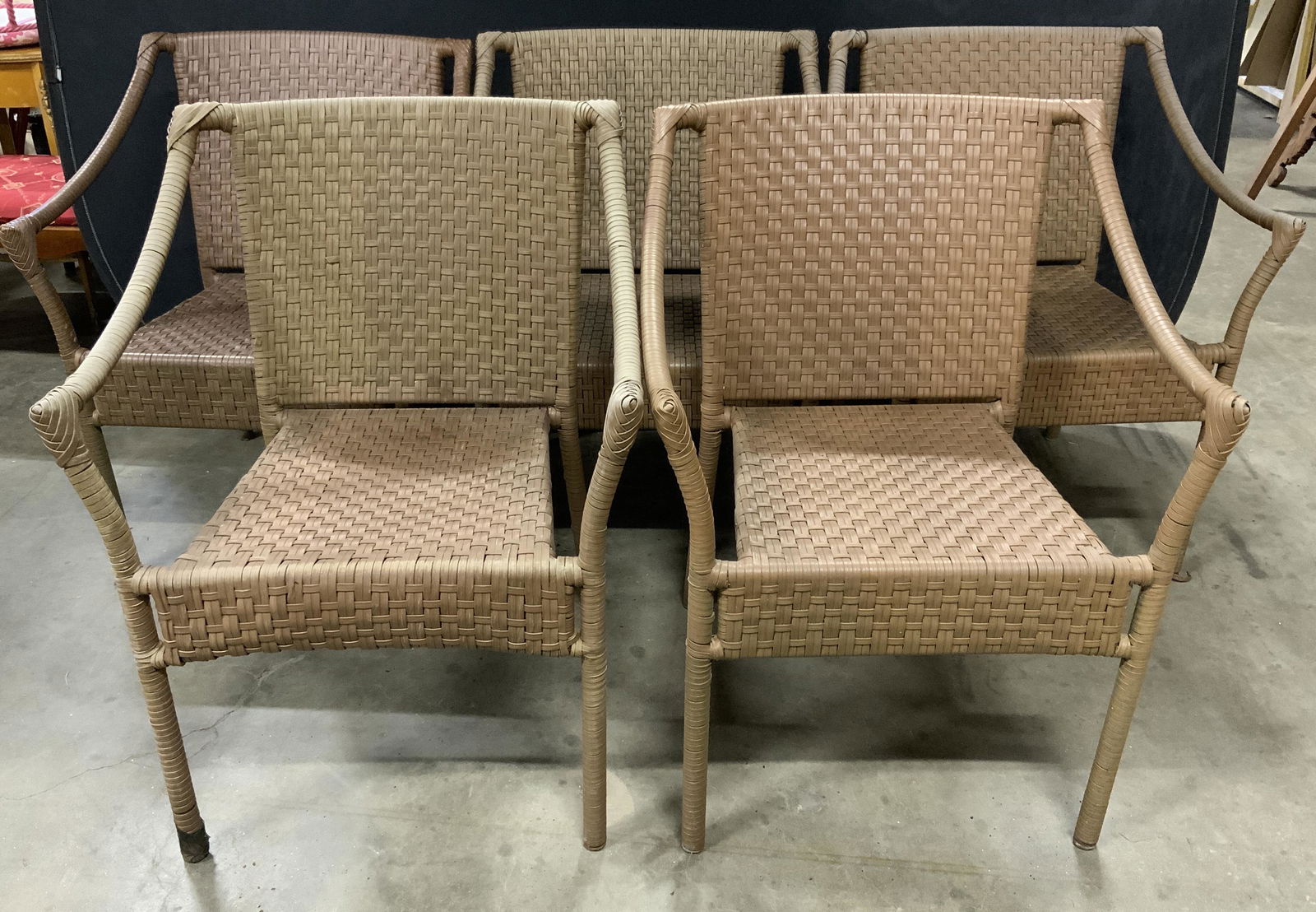 Set 5 Woven Outdoor Chairs: Set 5 woven outdoor chairs. Woven synthetic material. Surface wear, discoloration consistent with age, use, and exposure. Each measures approx 32 inches h, 22.5 inches w, 26 inches deep. Patio furnitu