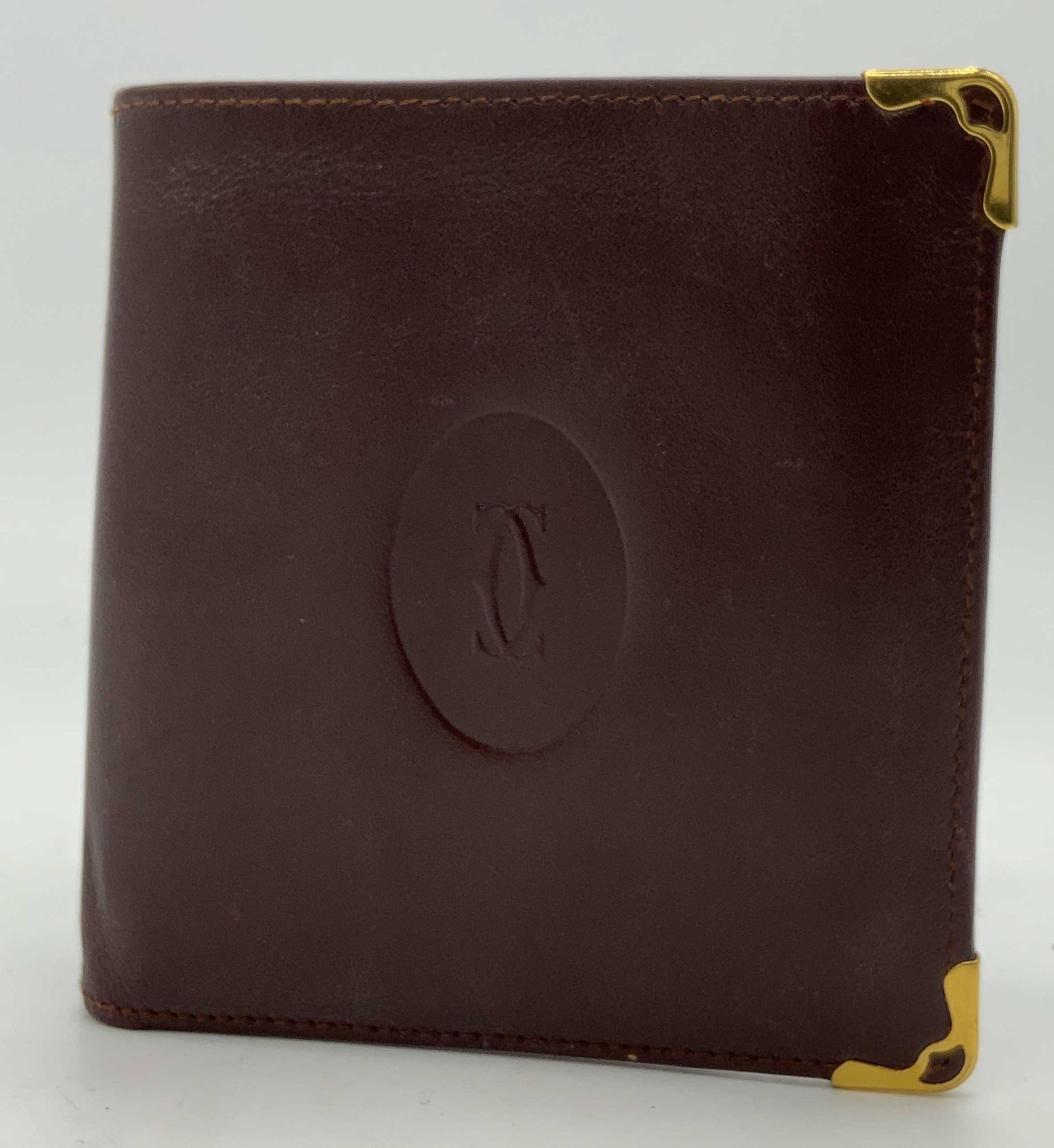 VINTAGE Cartier PARIS Maroon Wallet: VINTAGE Cartier PARIS Maroon Wallet, measures 4 inches x 7 1/2 inches, wear consistent with age and use. Property of a Manhattan, NY estate. Wearables, mens wearables, mens accessories, mens wallets, 