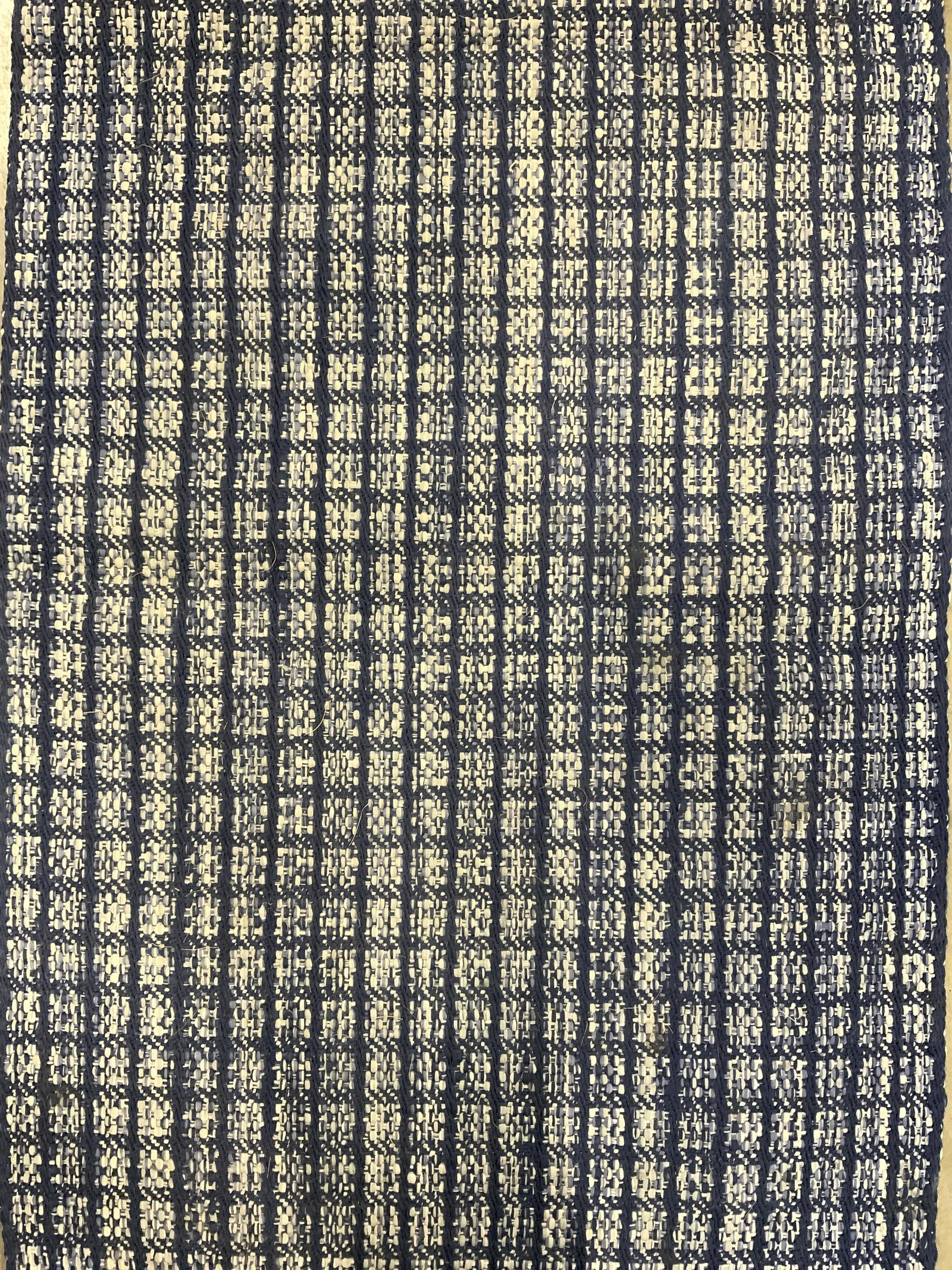 DASH & ALBERT Handwoven Polypropylene Rug: Underside has tag which reads DASH & ALBERT RUG COMPANY HANDWOVEN POLYPROPYLENE UV RUG SIZE 2 ft X 3 ft. Rug has blue & white toned pattern weave. Rug, carpet, area rug, polypropylene rug, dash and Al