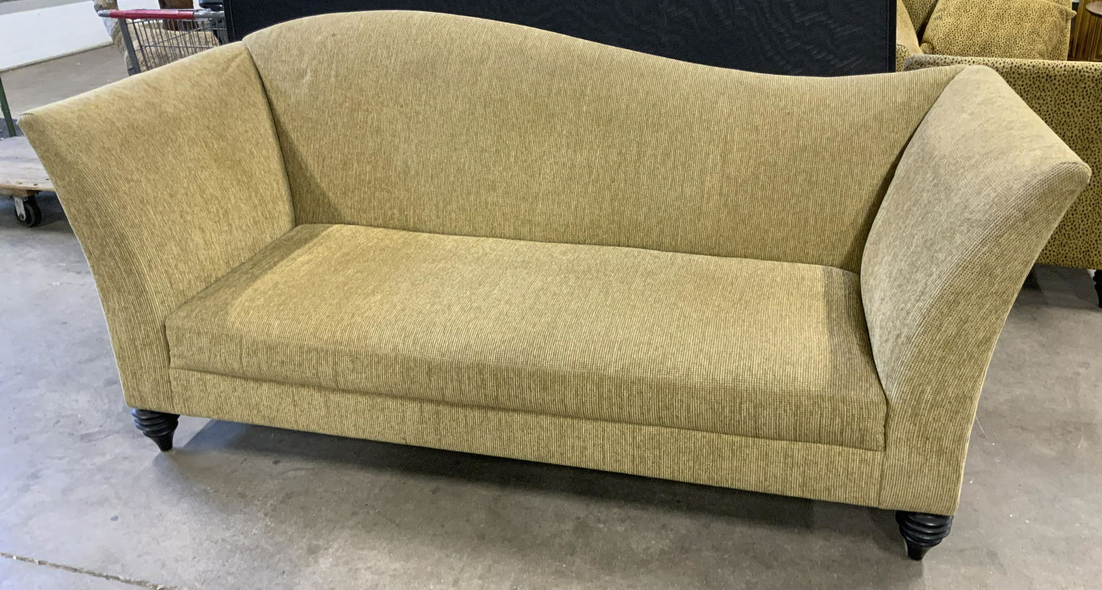 Vintage LARRY LASLO Sofa: Vintage sofa. Khaki toned, chenille upholstery. Carved multi tiered, wooden feet, feet tapered downwards. Wear is consistent with age and use, upholstery needs cleaning. Measures approx 41.25 inches h