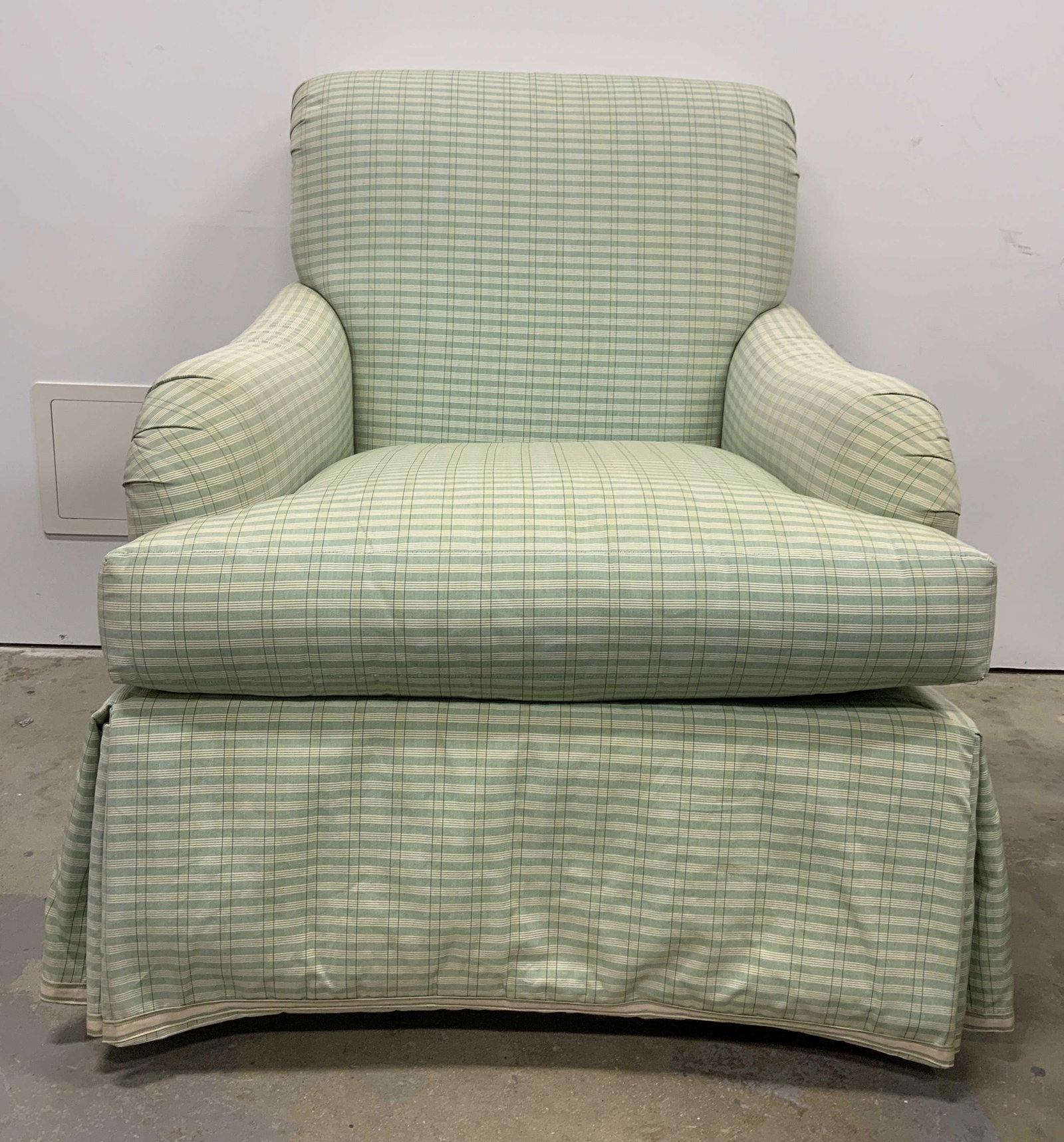 Custom Upholstered Club Chair: Like green toned club chair. Chair is skirted, cushion is removable, appears to be vintage. Staining, fading, and surface wear present. Measures approx 35 inches h, 30 inches w, 39 inches deep. Club C