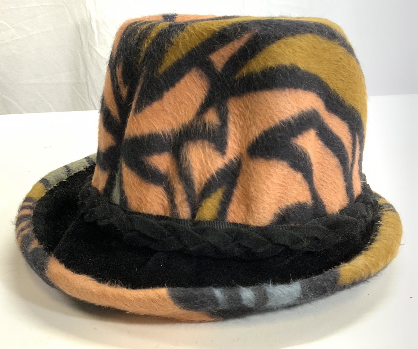 SANREMO Fur Style Italian Hat W Box: Lot includes hat and hat box. Interior of hat is marked SANREMO MADE IN ITALY. Hat has beige, black, slate and sienna tones. Hat also has braided band. Hat is in the style of fur. Piece measures appro