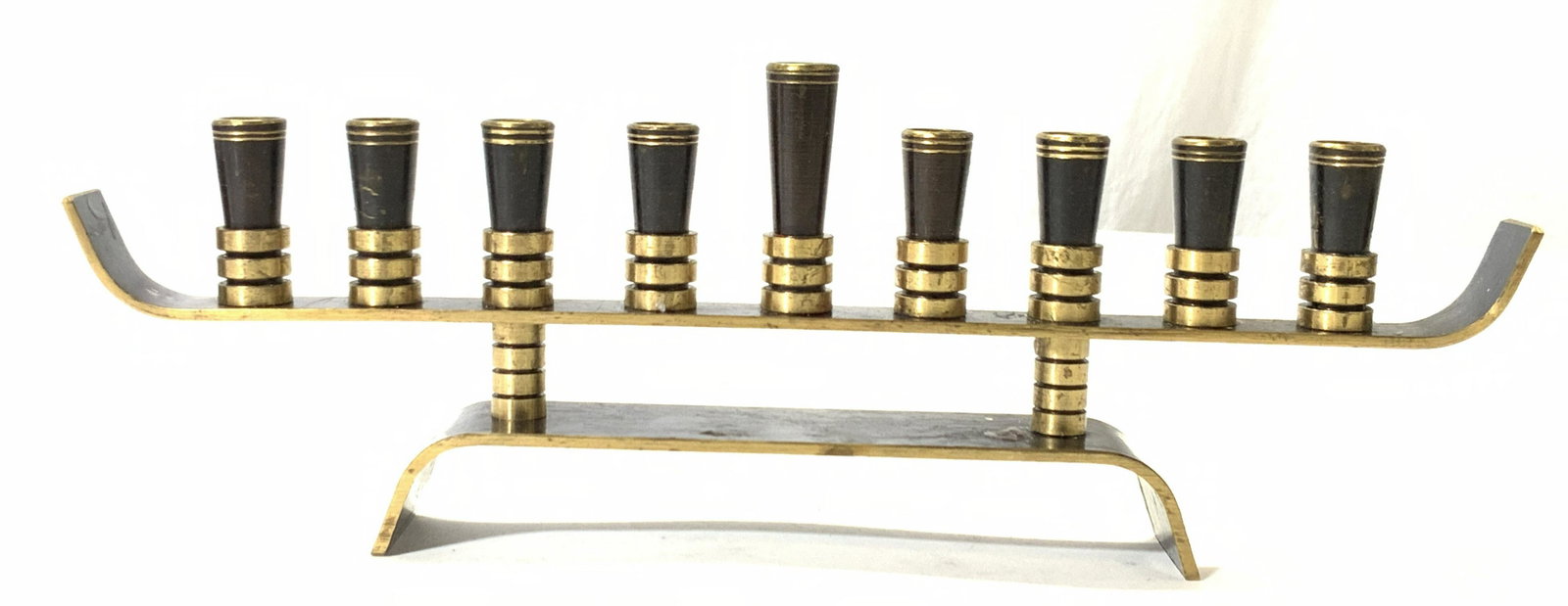 Painted Brass Menorah: Brass made Menorah, painted black. Approximately 9.5 inches wide and 3.25 inches tall. Marked Jerusalem on stand. Brass menorah, Jeddah, Judaica, Judaism, Jewish, Hanukkah, Hanukkah menorah, Jerusalem