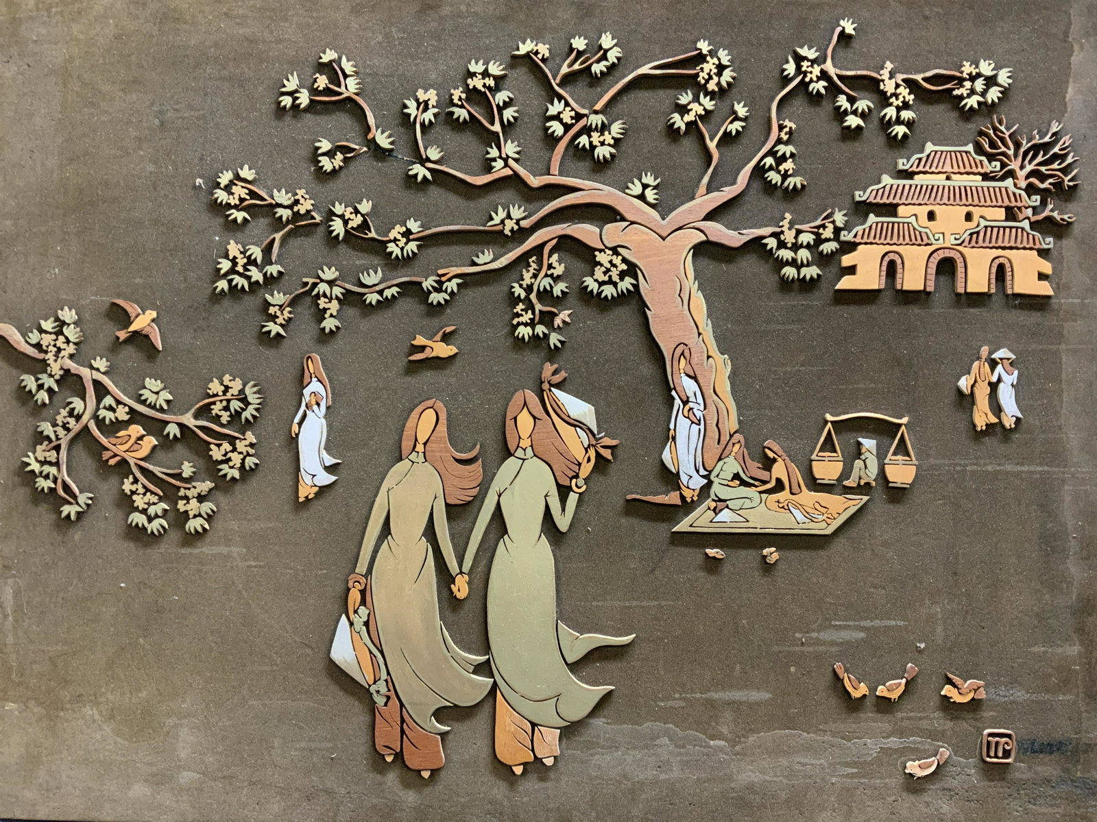 Signed Wood Cutout on Velvet Artwork: Signed Wood Cutout on Velvet Artwork, signature to lower right illegible, shows a park/temple scene, shows various women lounging through out the park, measures 34 1/4 x 24 inches. Velvet on board. Sm