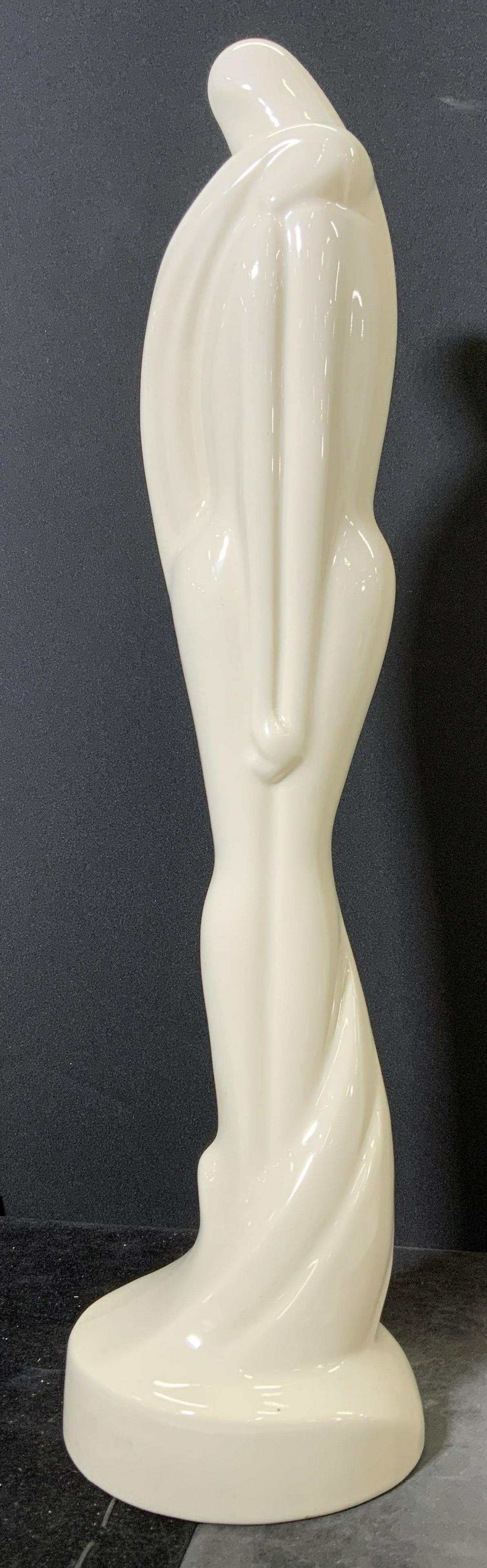 HAEGER Ceramic Sculpture LOVERS EMBRACE: Vintage ceramic sculpture. Depicts a male and female figure embracing each other. Underside label reads as HAEGER AMERICAN MADE. Measures approx 20.5 inches h and 5.5 inches w. Home decor, decorative 