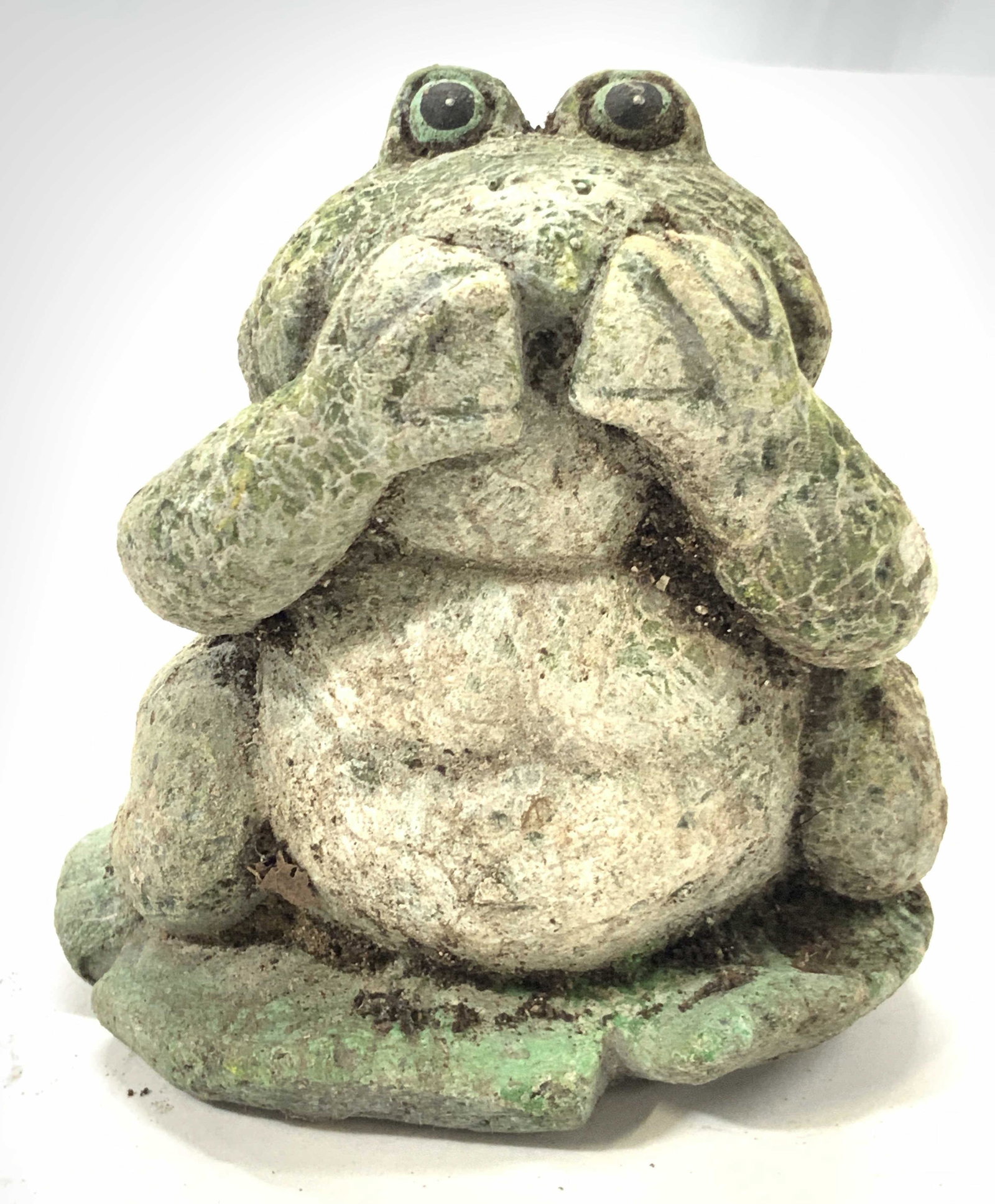 Green Stone Garden Toad Statuary: A stone made toad, sitting on a lily pad, with its hands over its mouth, (similar to see no evil, hear no evil, speak no evil) painted green. Approximately 5 inches tall. Needs cleaning. Garden decor,