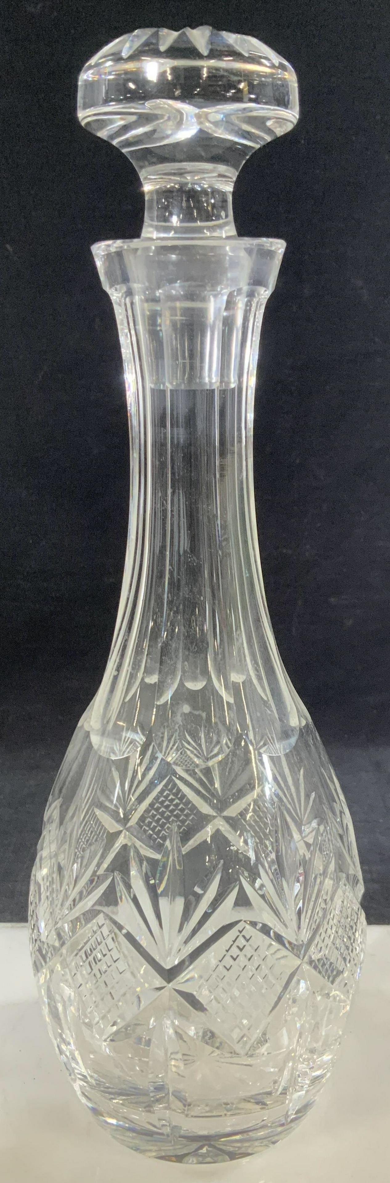 Cut Glass Vintage Decanter w Stopper: Cut glass decanter with stopper, thick walled glass, multiple cut patterns , narrow bottle neck. 11 in. Total ht. , 4 in. Width. Stopper is 3.25 x 2.25 in. Vintage Barware, Vintage Glassware, Cut Glas