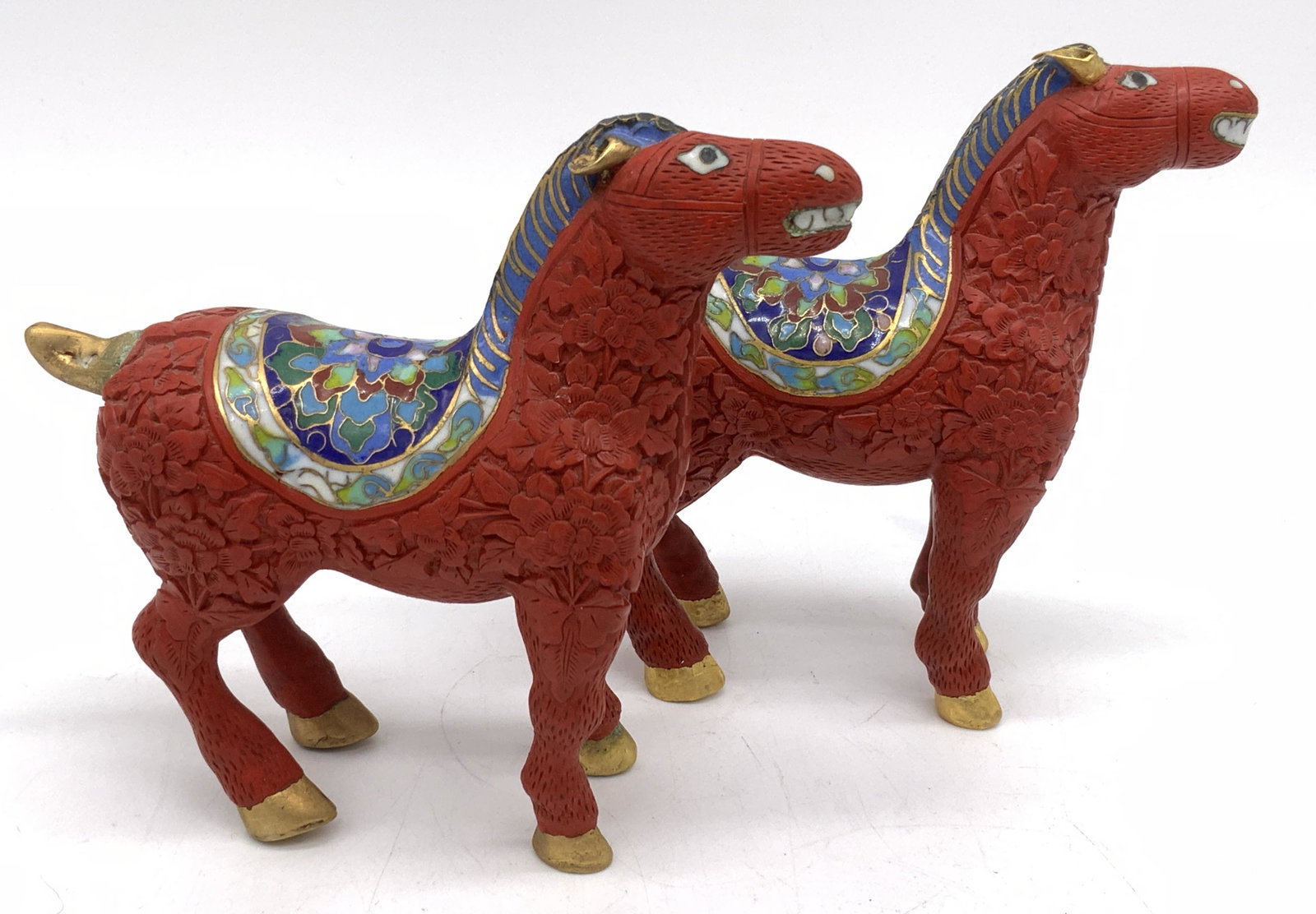 Pair Imari Style Sculptural Horses: Pair Imari Style Sculptural Horses, red body relieved with floral design, imari style saddles, gilt hooves, ears, and docks, composite material, each measure approx 5 in. tall, 5 in. long, and 1 3/4 i