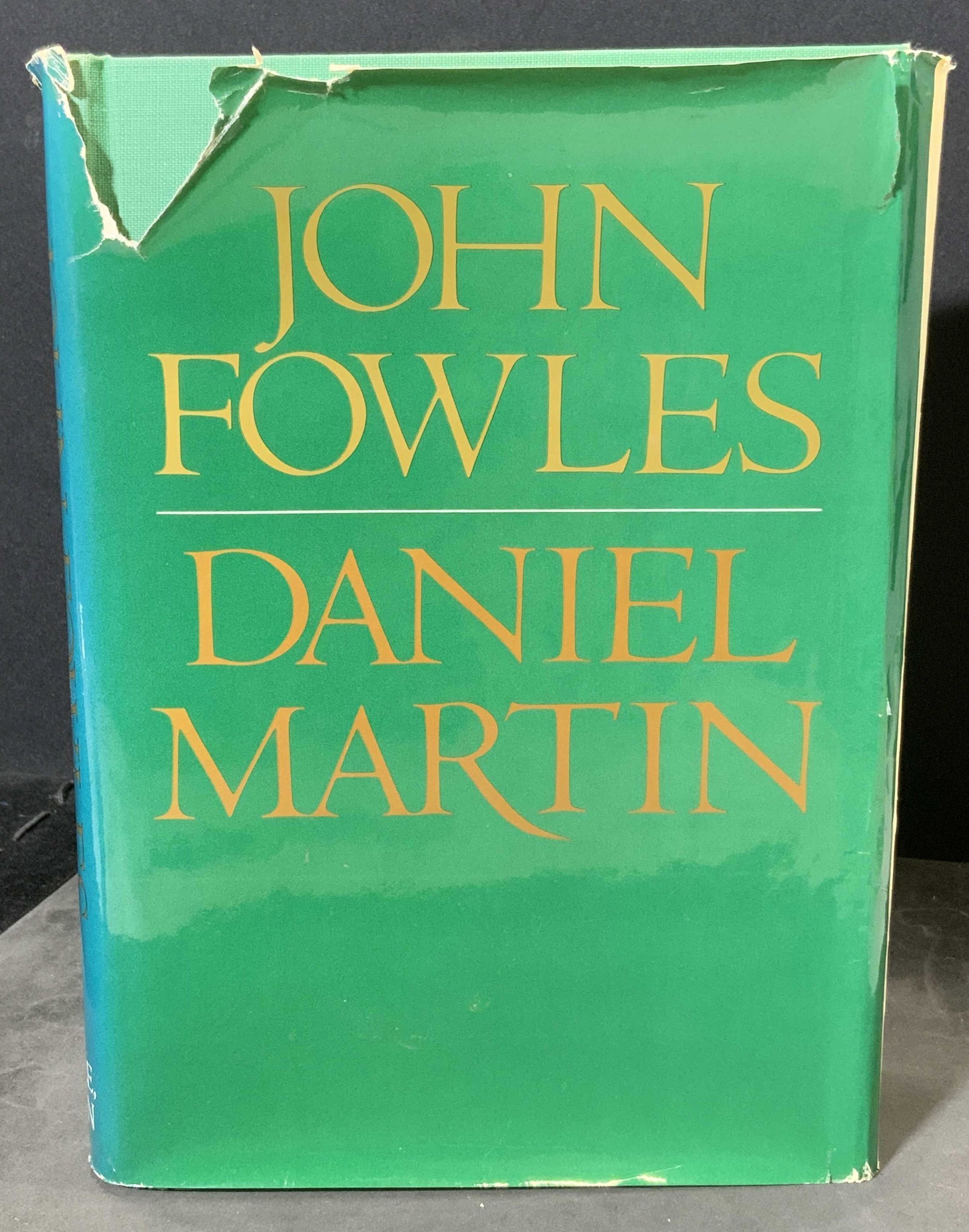 Signed Hardcover Daniel Martin by JOHN FOWLES: Signed hardcover copy of Daniel Martin by John Fowles. Bound in fabric, includes dust sleeve, heavy wear to dust sleeve, wear to binding. Measures approx 9.5 inches long and 6.75 inches w. Copyright 1