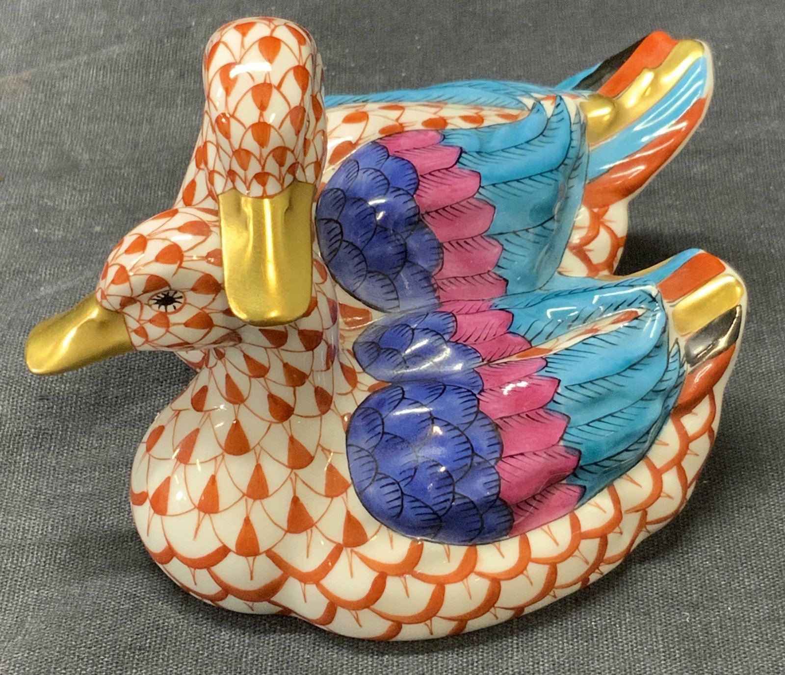 HERENDS HUNGARY Porcelain Ducks Figurine, Hungary: HERENDS HUNGARY Porcelain Hand Painted Ducks Figurine, Hungary, two ducks in affectionate pose, with red geometric pattern, gilt beaks, multicolored wings and tails, verso is stamped ‘HERENDS HVNGAR