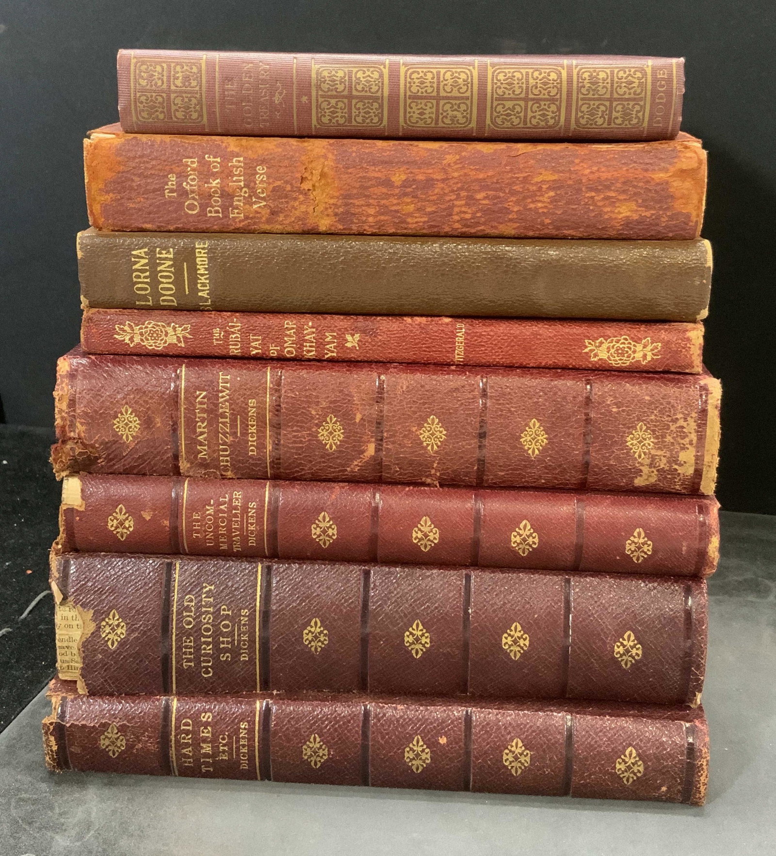Group Lot 9 Antique Books Dickens & Others: Includes The Golden Treasury by Francis T. Palgrave, The Oxford Book of English Verse by Arthur Quiller Couch, Lorna Doone by R.D. Blackmore, The Rubaiyat of Omar Khayyam translated by Edward Fitzgera
