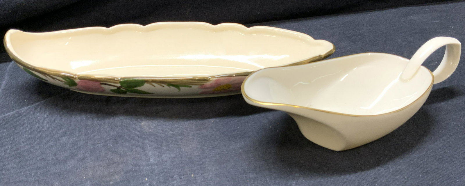 LENOX and FRANCISCAN Ceramic Lot of 2: LENOX and FRANCISCAN Ceramic Lot of 2, LENOX pourer vessel with gilt detail, verso stamped ‘Lenox Made In USA’ measures approx 2 in. tall, 7 1/2 in. long, and 3 1/4 in. wide. FRANCISCAN EARTHENWAR