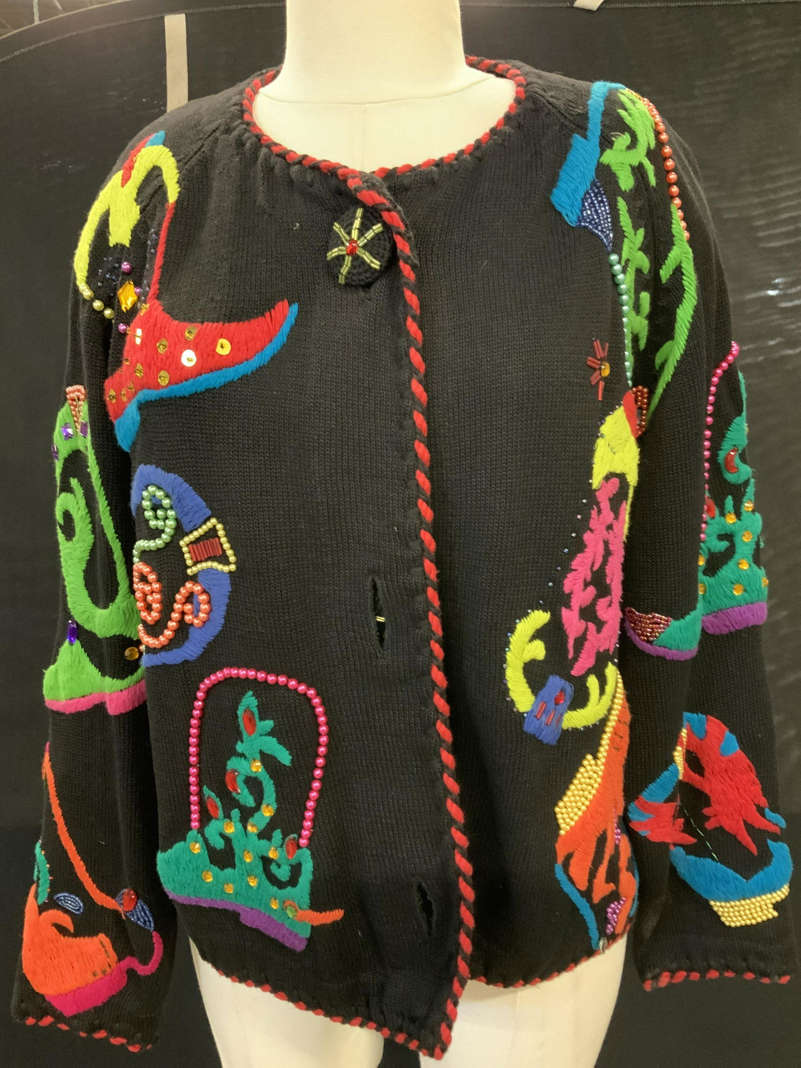 Michael SIMON Embroidered/ Bead Cardigan: C. 1991 designer Cardigan labeled Michael Simon New York. Black ramie/ cotton blend with hand embroidery and multi style beads. Cowgirl motif with western style boots hand finished in Hong Kong. Cotto