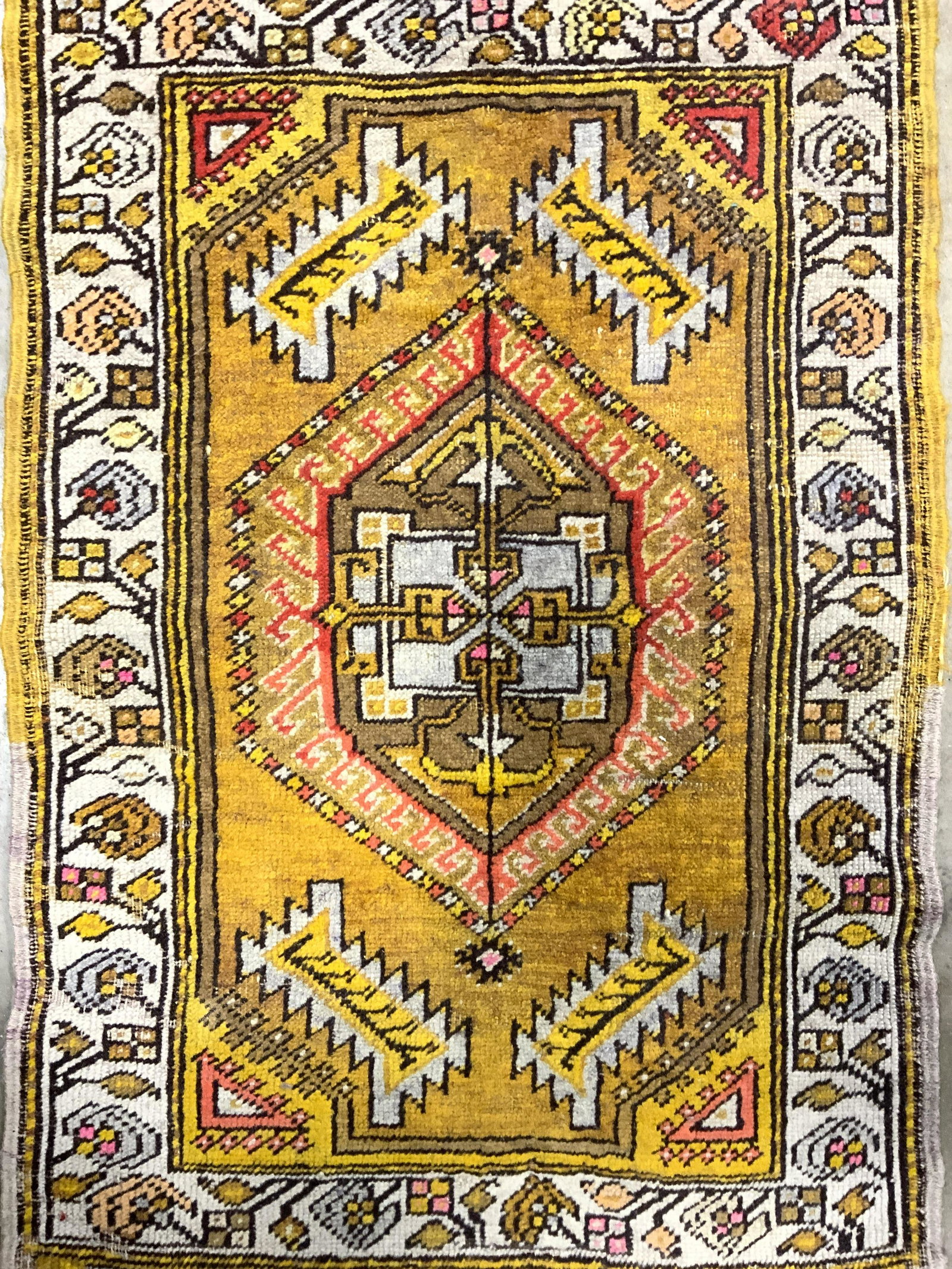Antique Handmade Turkish Yastik Wool Rug: Rug is handmade and wool. Piece is vintage possibly antique. Rug is Turkish Yastik. Piece has intricate multi toned geometric detail. Piece measures approx 33 inches long 20 inches wide. Rug, carpet, 