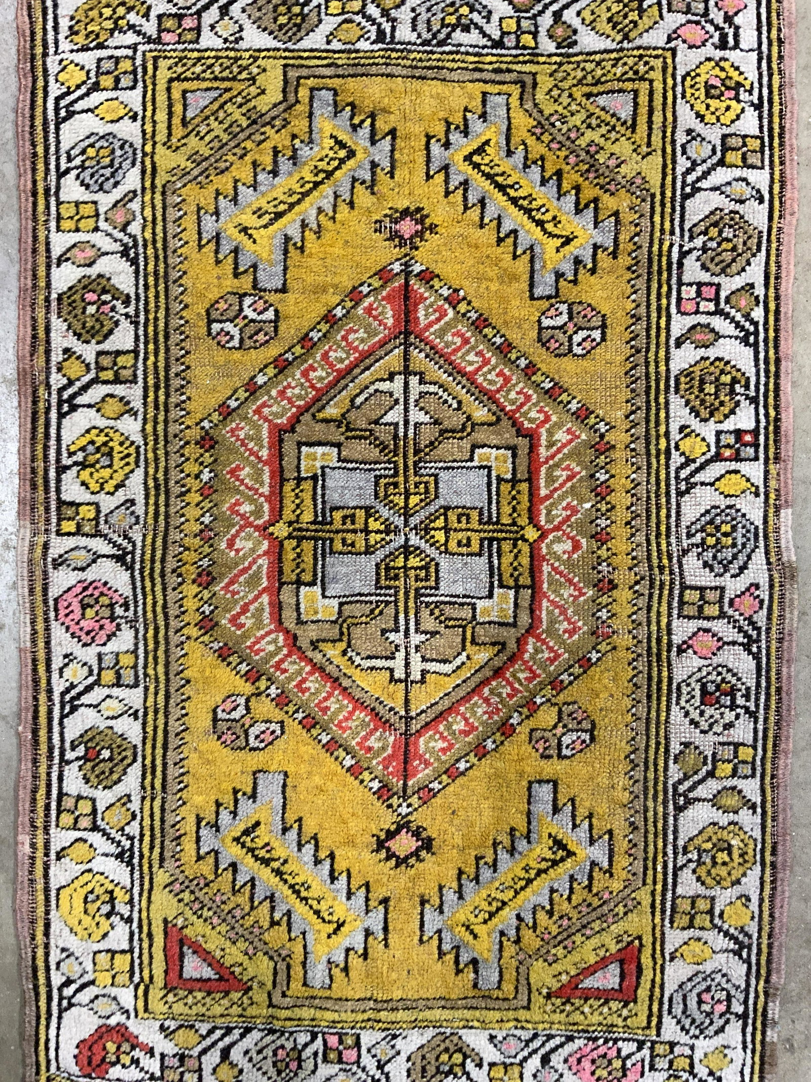 Antique Handmade Turkish Yastik Wool Rug: Rug is handmade and wool. Piece is vintage possibly antique. Rug is Turkish Yastik. Piece has intricate multi toned geometric detail. Piece measures approx 33 inches long 21 inches wide. Rug, carpet, 